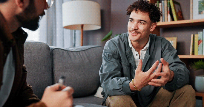 two men talk in therapy session