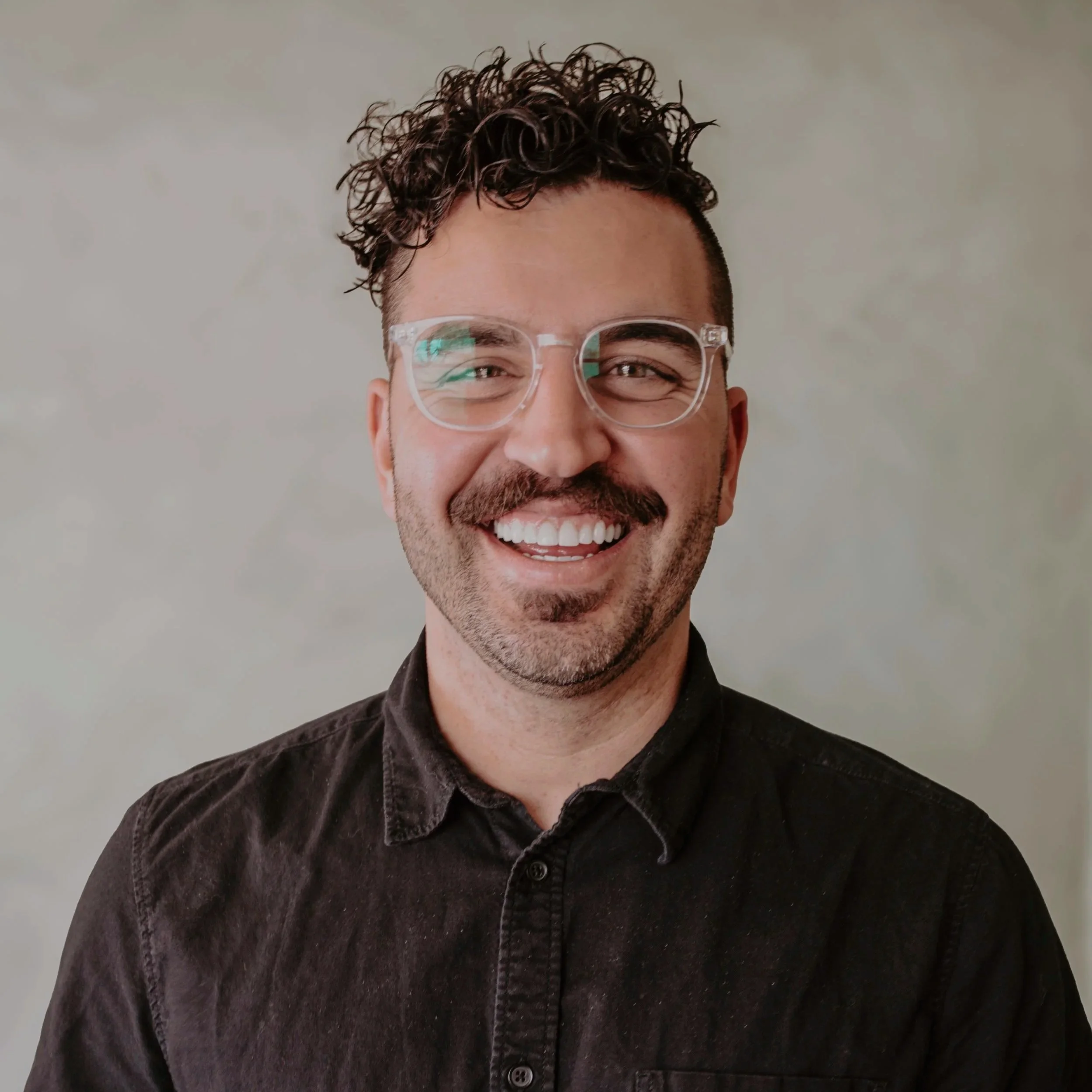Man smiling at the camera.