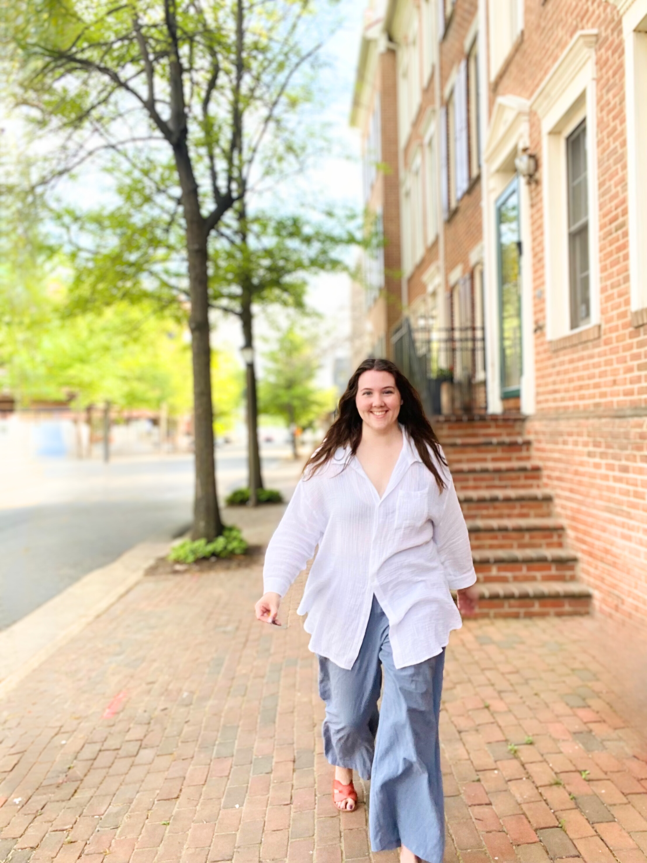 Signal Strategies founder walking confidently with a friendly smile, ready to guide small businesses and nonprofits with clear, strategic marketing.