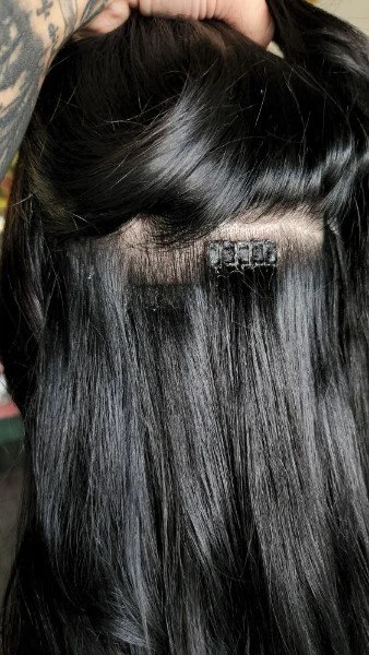 hairdreams laser beamer nano hair extensions shown on a client in salon