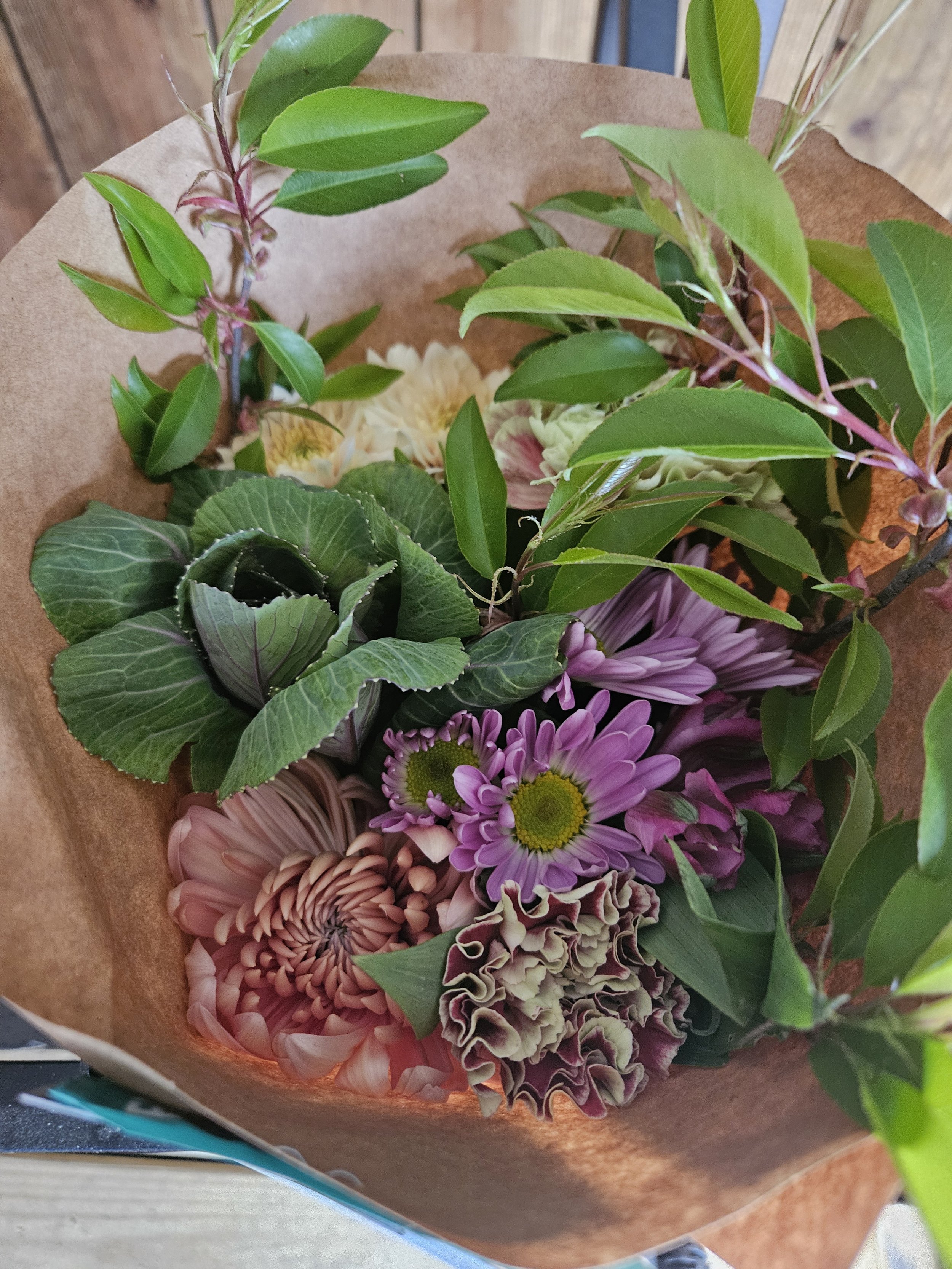 Florist arranging handcrafted bouquets for Three Petals LLC flower subscription service in Millville, NJ