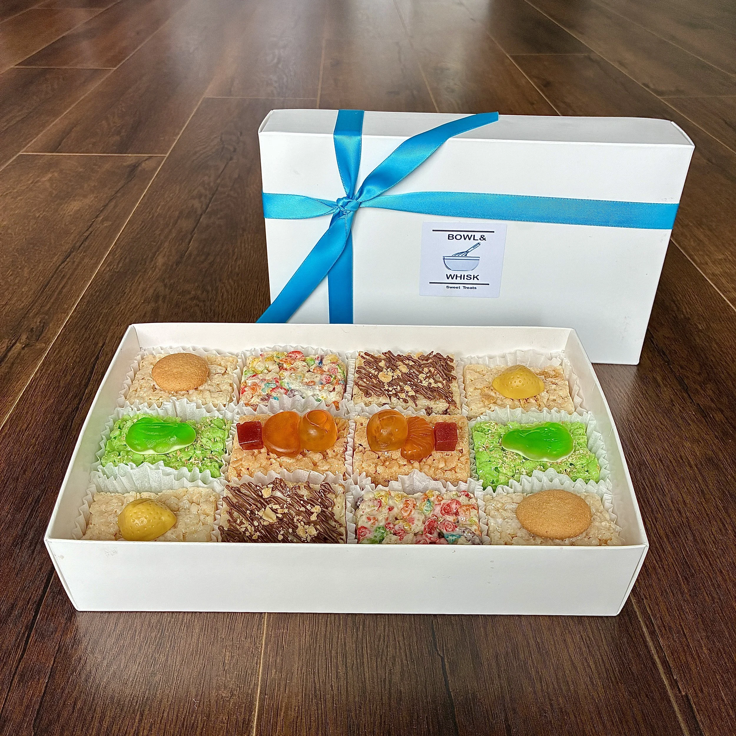 Our Sept  2026 Gift Box of Rice Crispie Treats, containing 2 pieces each of banana pudding, guava matcha, rainbow pebbles, root beer float, strawberry margarita and strawberry shortcake flavors