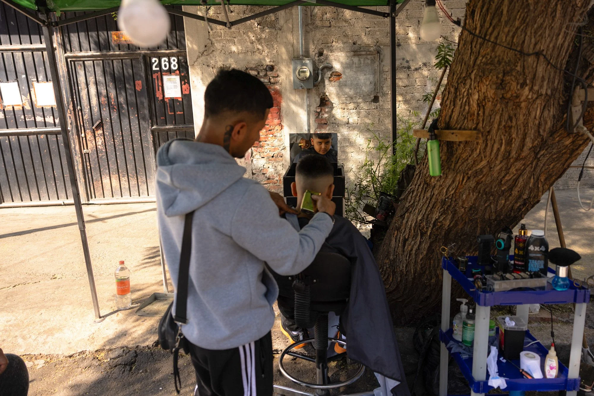 Makeshift hair salon at the tent camp.