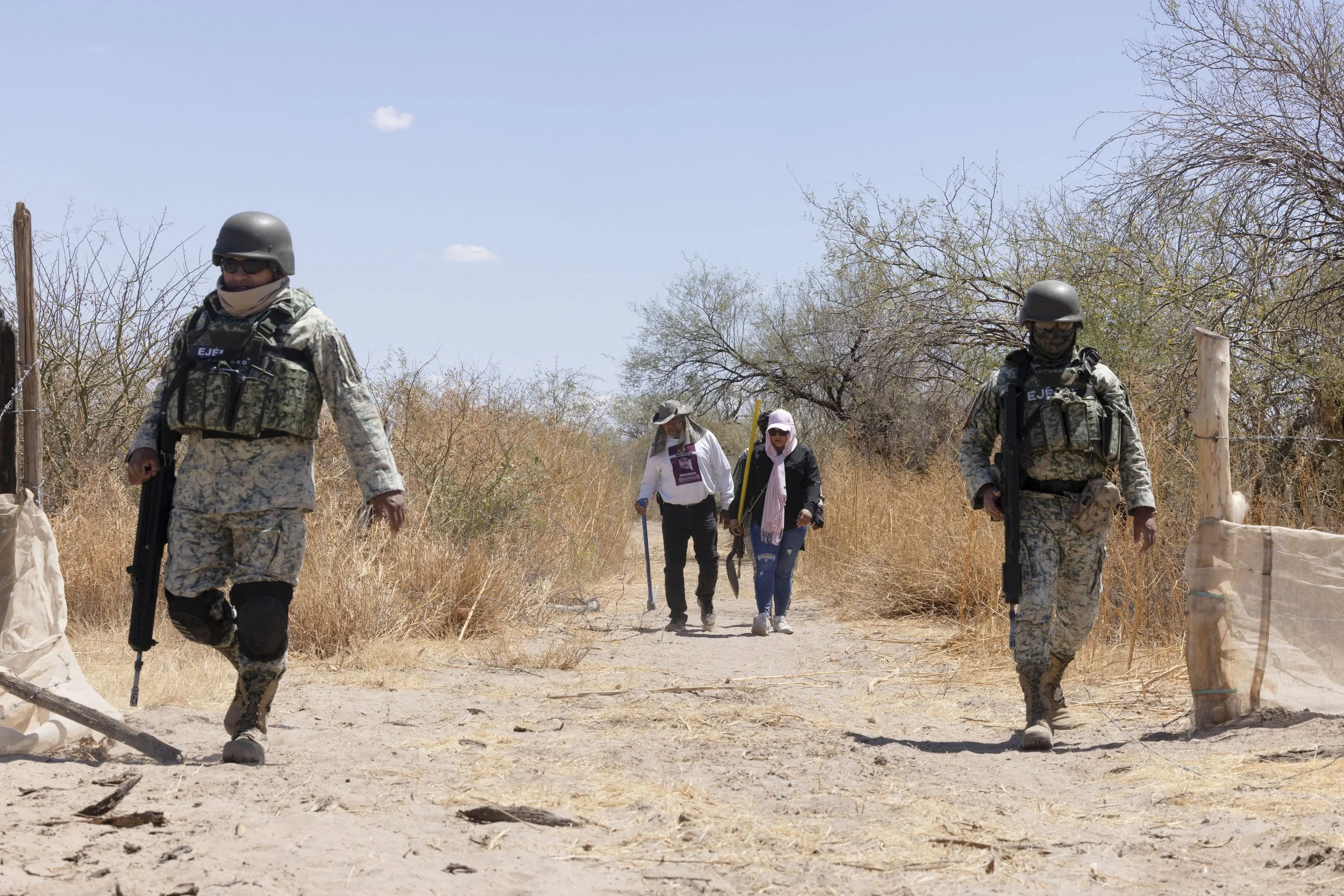 The search continues.
Military escort.