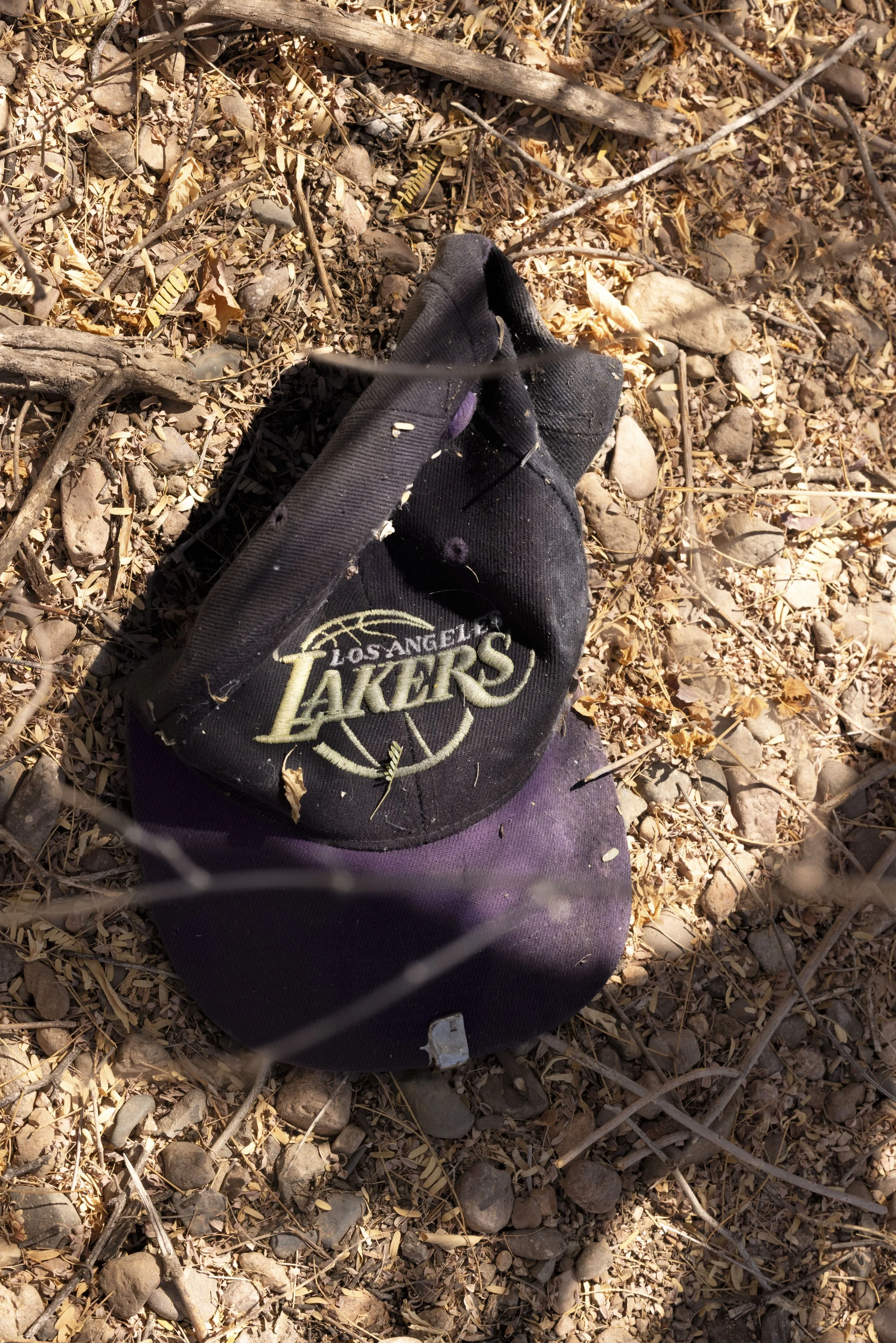 A sun-bleached cap.
It belonged to the woman found at the roadside.