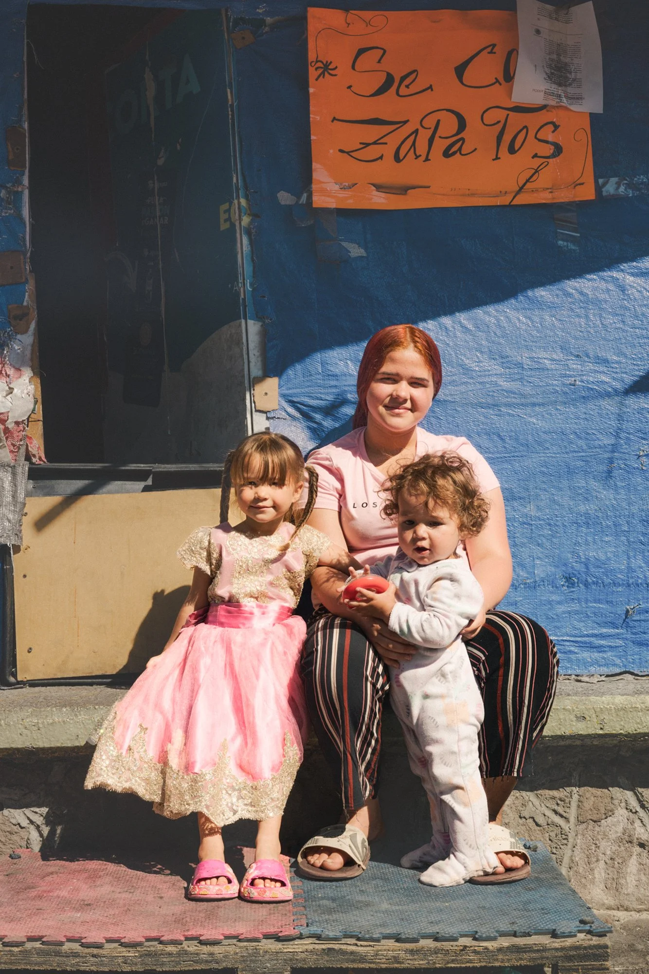 Mother Paola, 17, from Maracaibo, Venezuela.
Daughters Antonella and Alejandra, both born in exile.