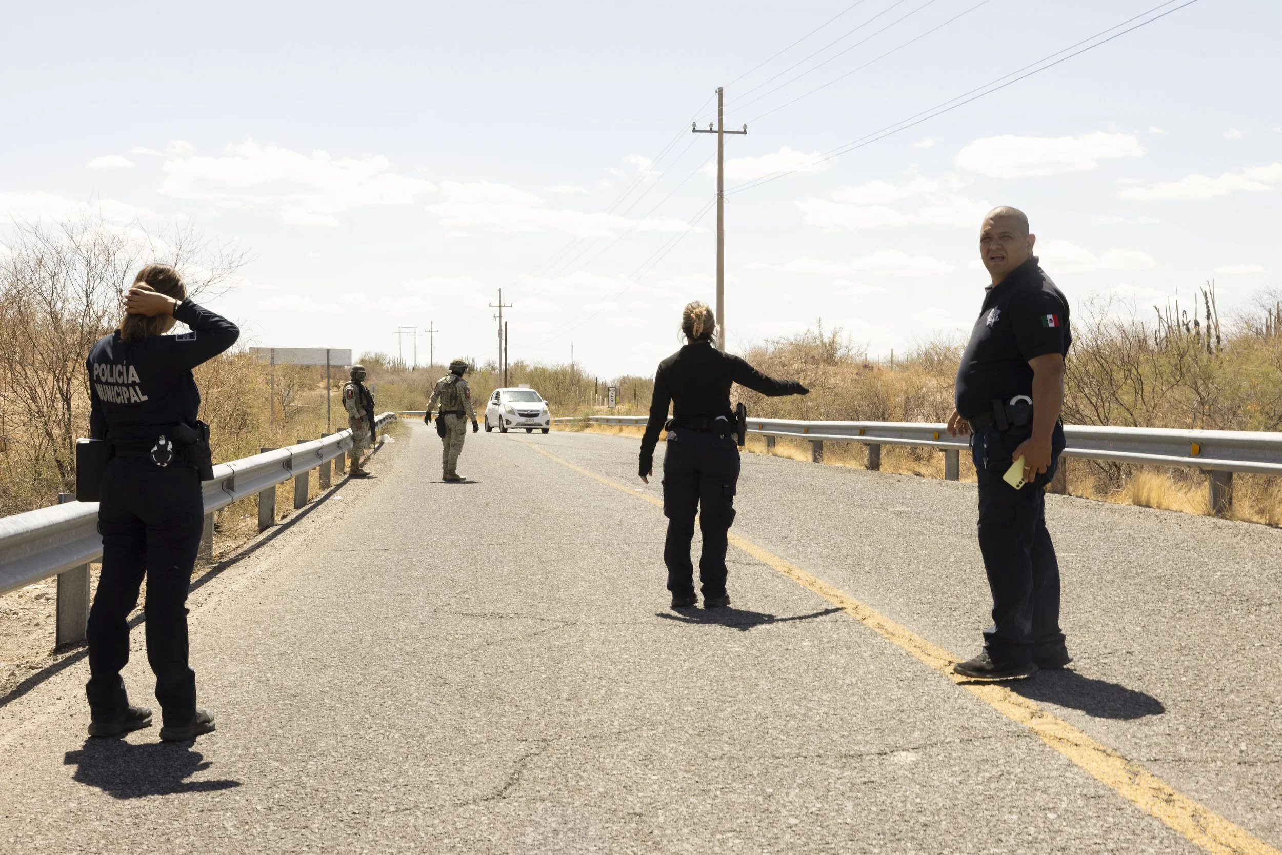 Police and military close the road.
Remains have been found.