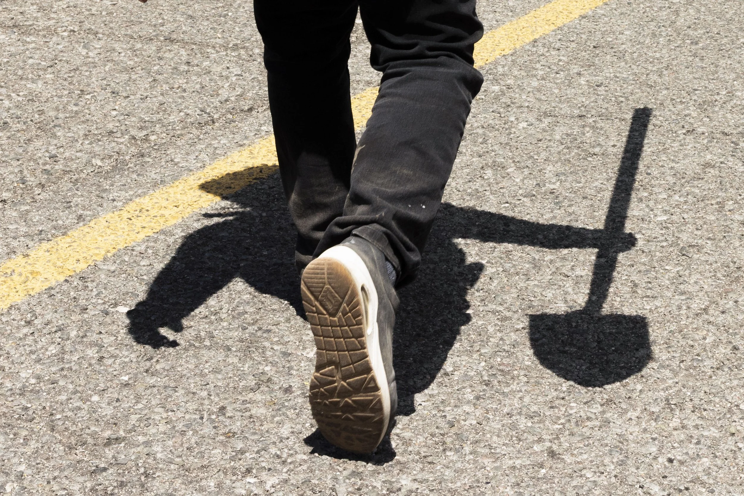 A man with a shovel.
In the field.