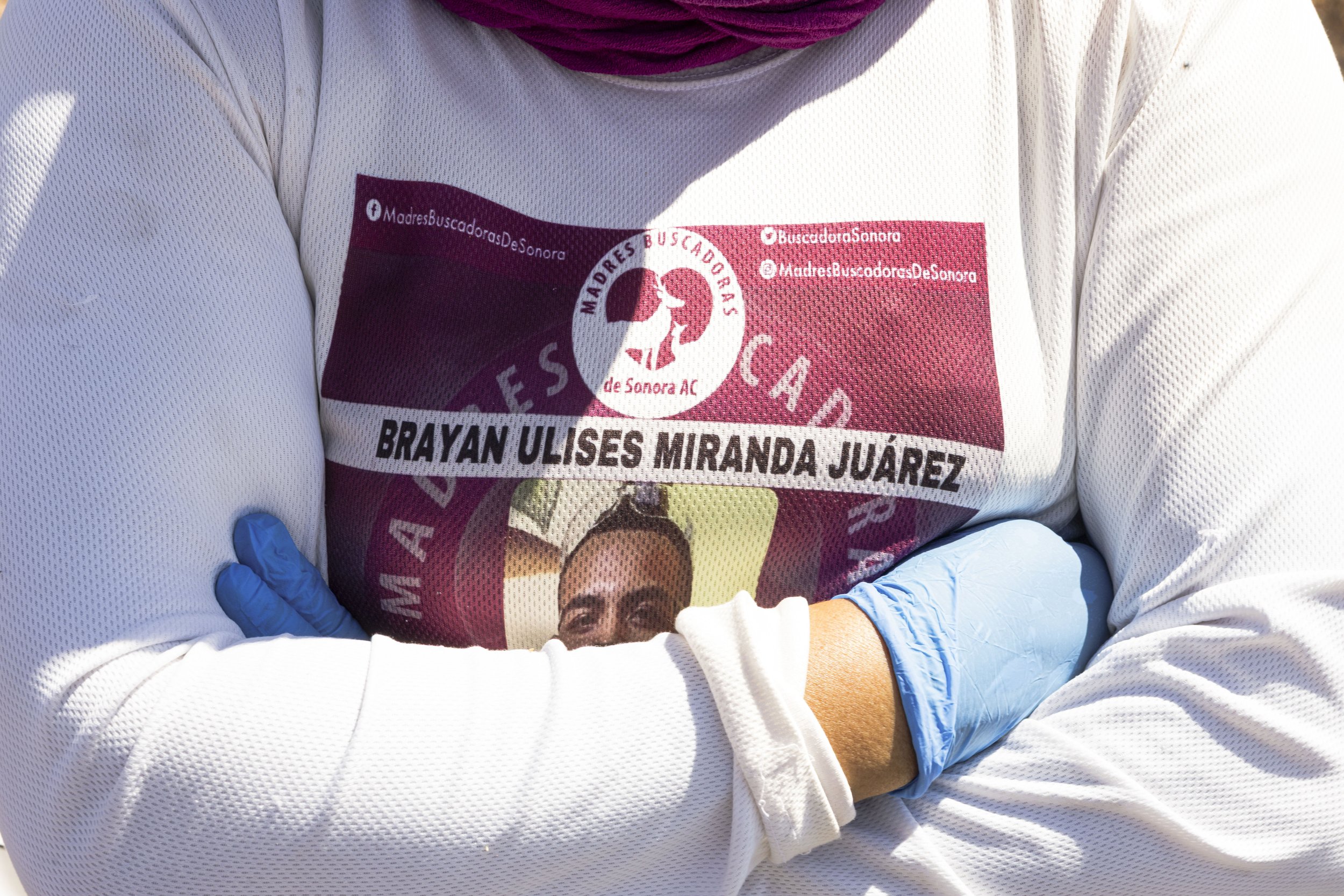 Ana Luisa's.
Her son Brayan's photo, printed over her chest.