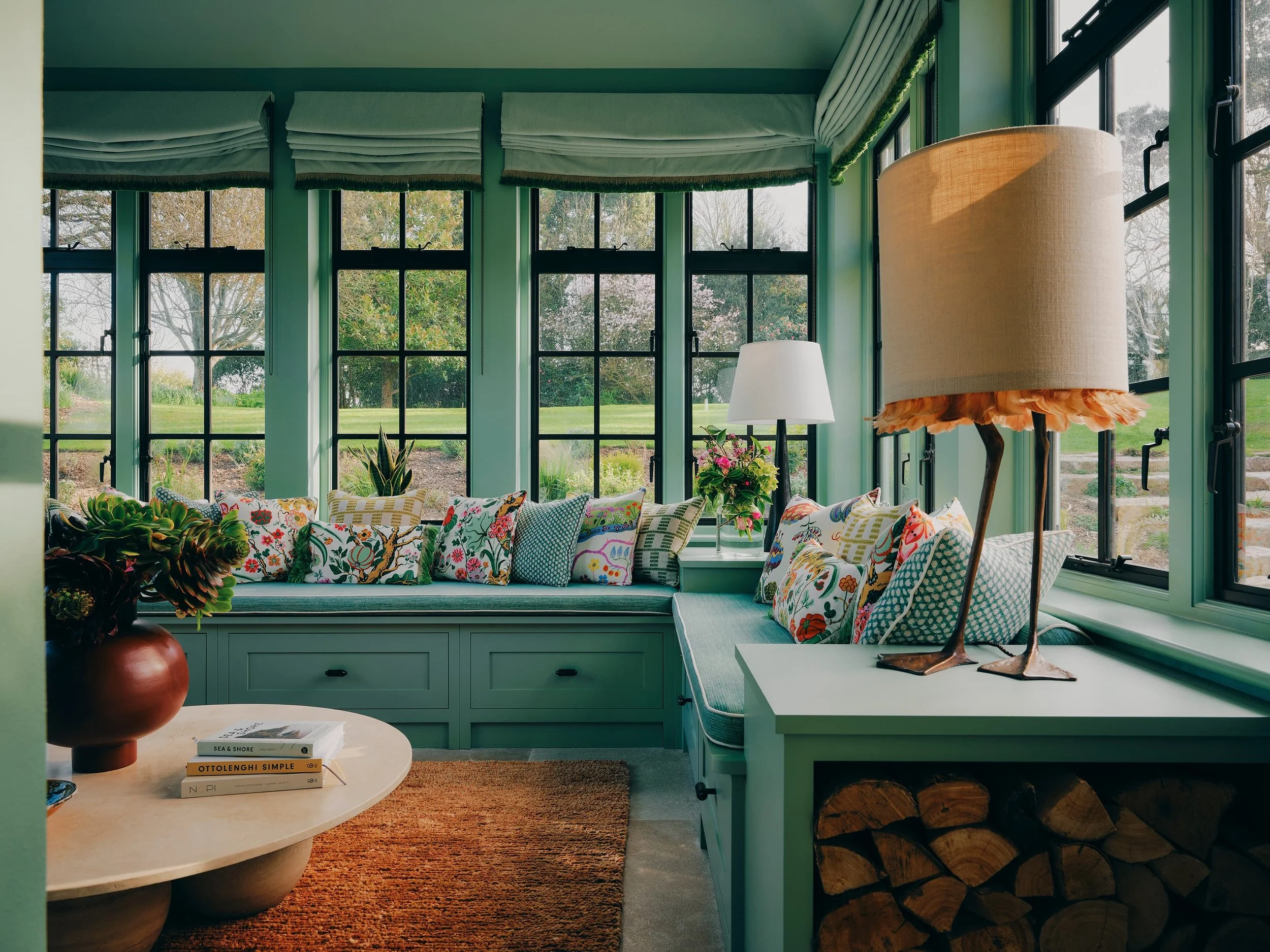 "Garden room window seat with patterned cushions in a Jersey rural rectory by Bryony Richardson"
