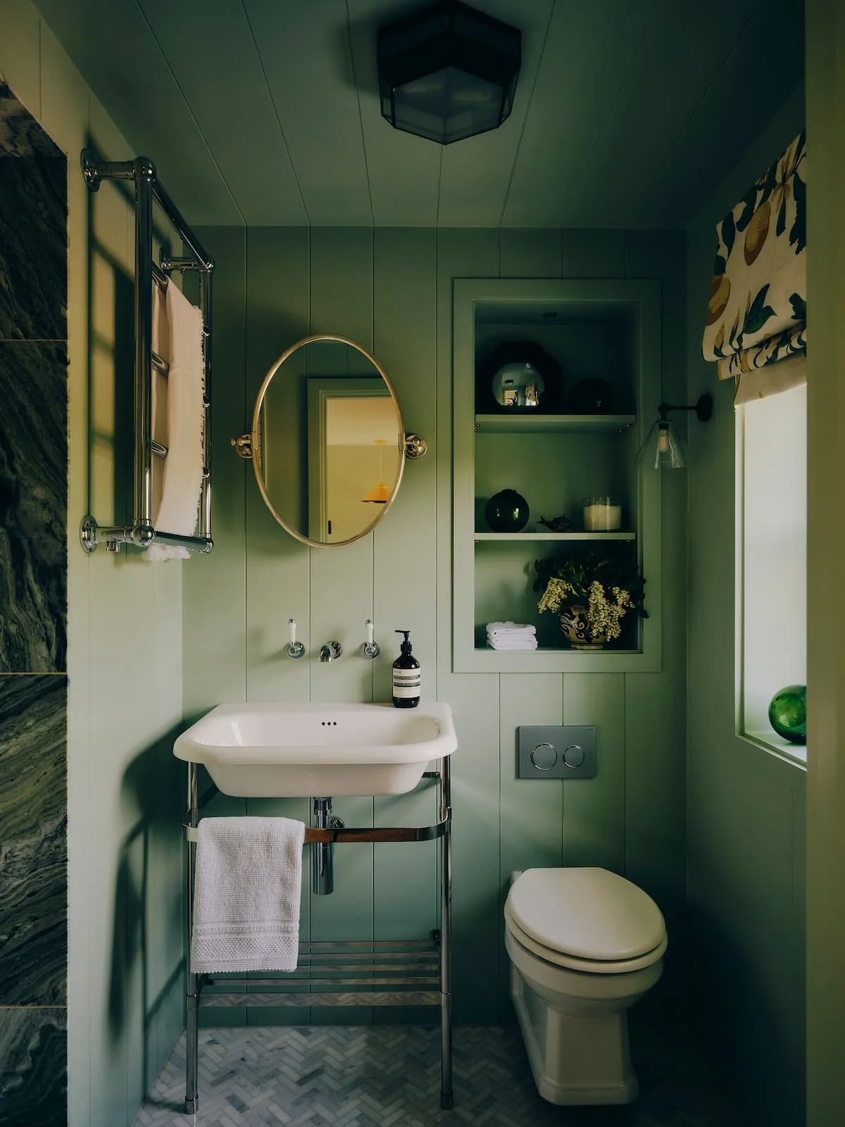 Sea green ensuite with tongue and groove cladding, veined green marble in rural rectory in Jersey