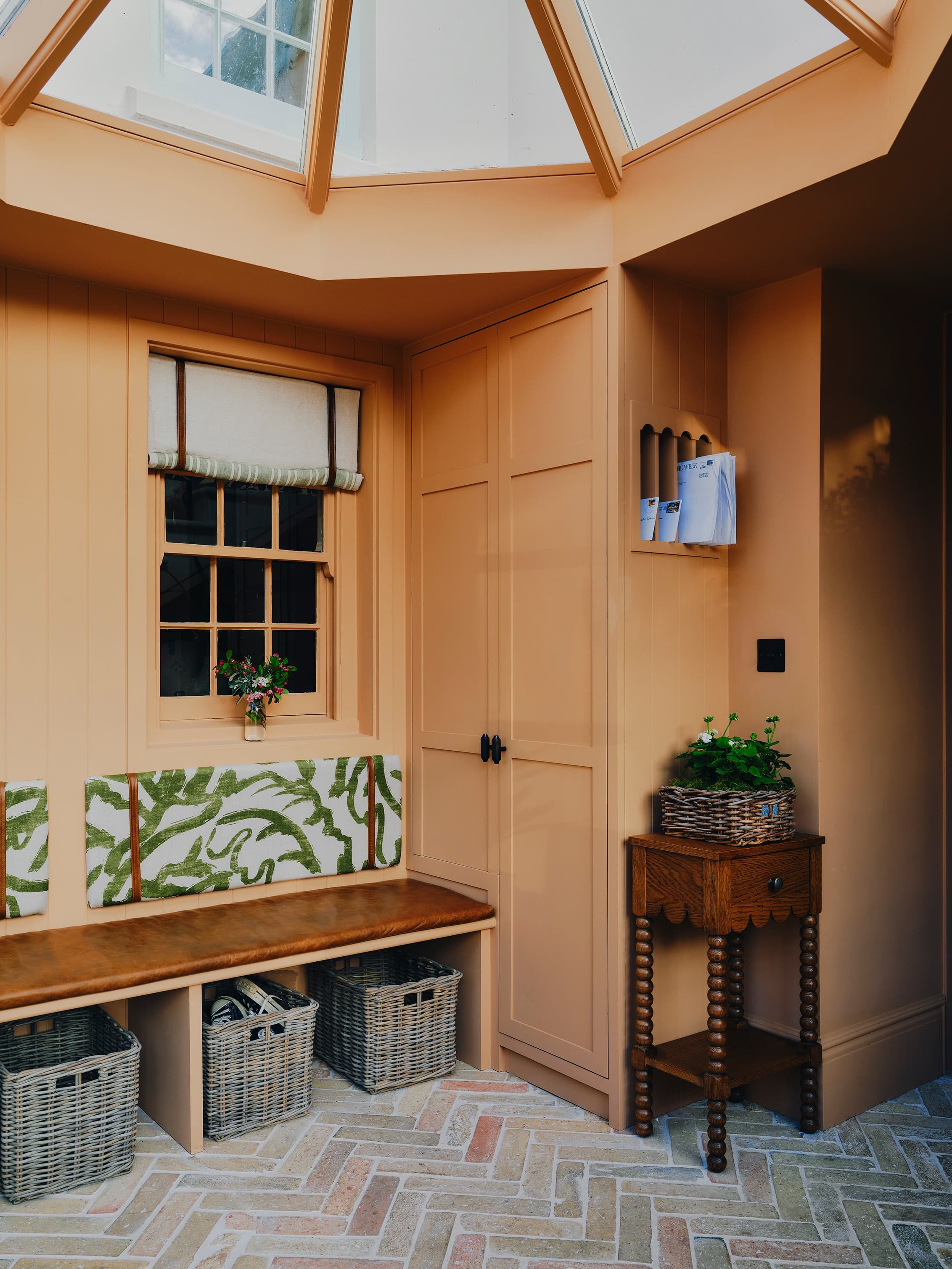 "Boot room with glass lantern roof and woven storage baskets in a Jersey rural rectory by Bryony Richardson"