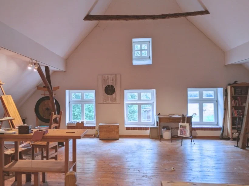 new studio space with big windows and natural light