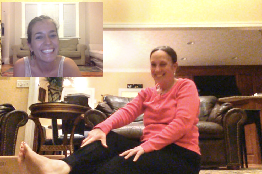 Ann Swanson on a video call with a client practicing yoga therapy