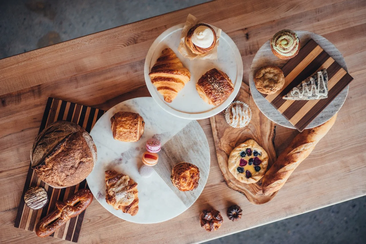 Assorted pastries from La Fillette, Sourdough, macarons, Cinnamon roll, croissant, scones, gallette