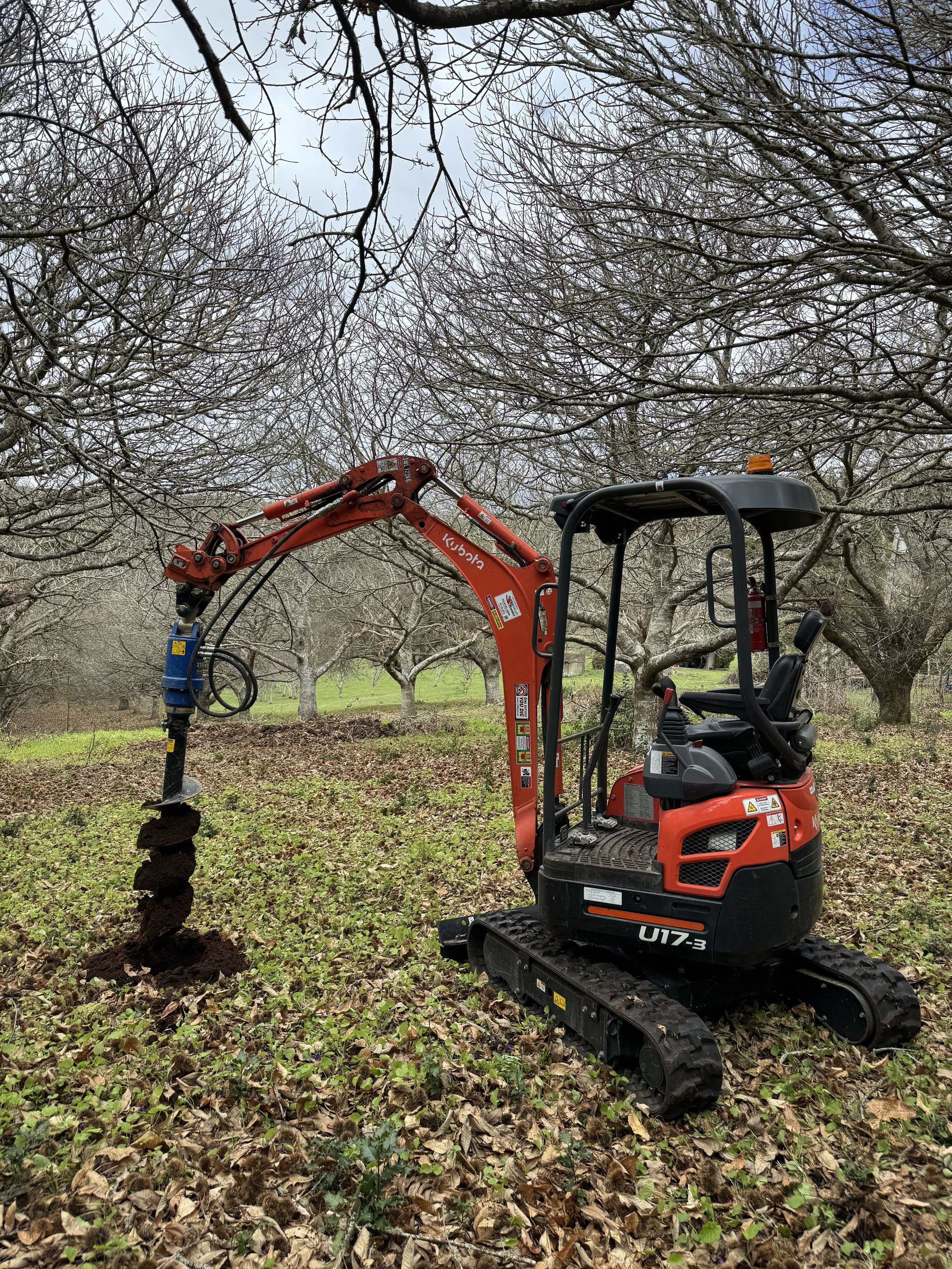 Mini excavator Auger post holes for fence
