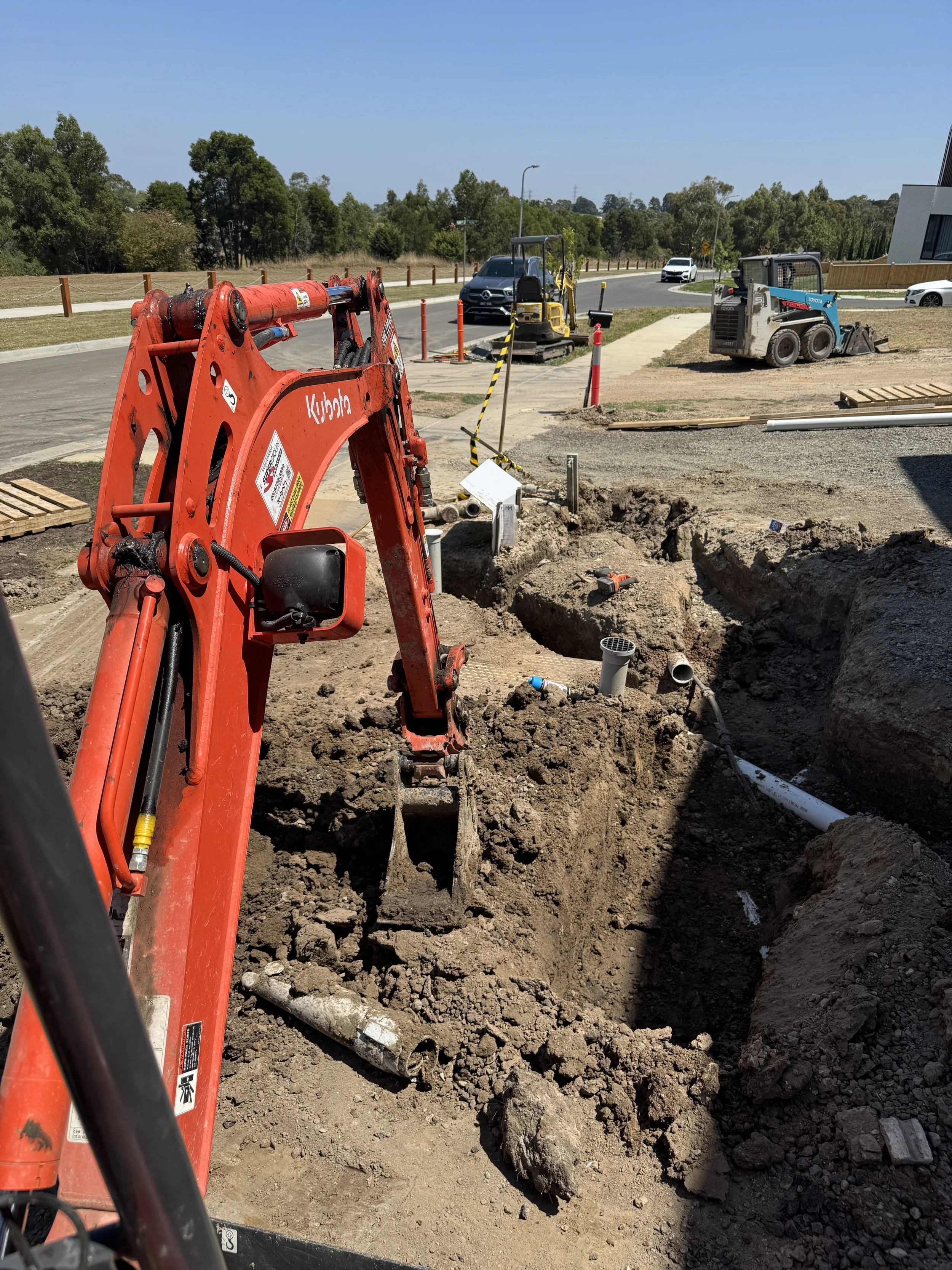 Retaining wall footing trenching