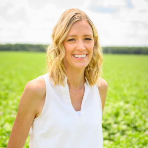 Wendy Alsum-Dykstra Headshot with farm field in background