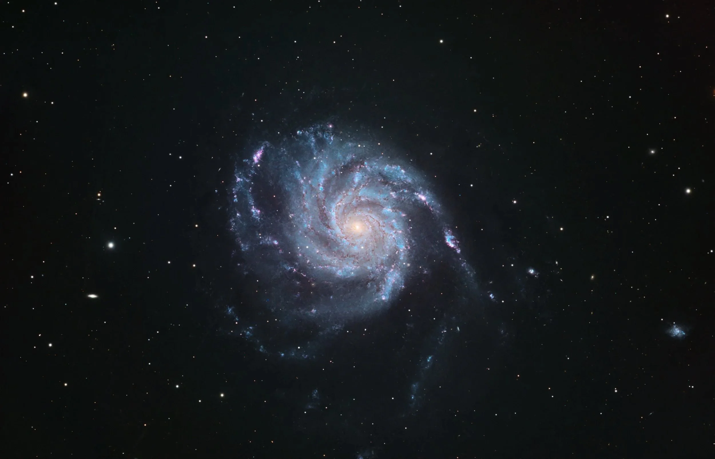 M101 – Pinwheel Galaxy, captured with a Celestron C9.25 EdgeHD at f/7 and an ASI2600MM Pro camera with LRGBH filters. Image by Cosmic Captures