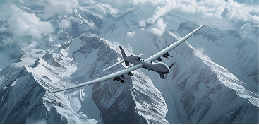 Image of an unmanned aviation vehicle flying over snowy mountains in the background