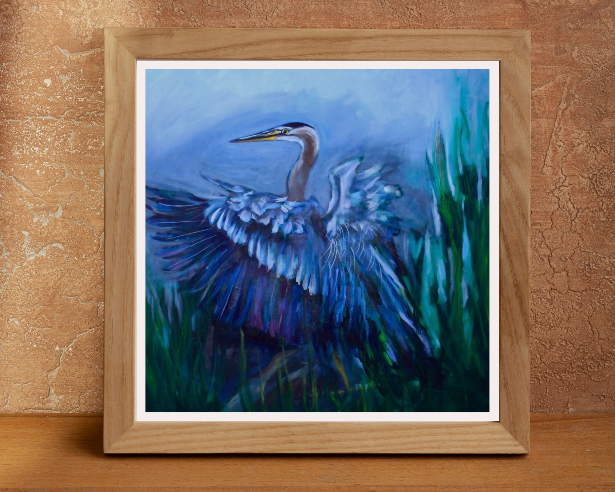 blue heron framed painting on a burned orange background