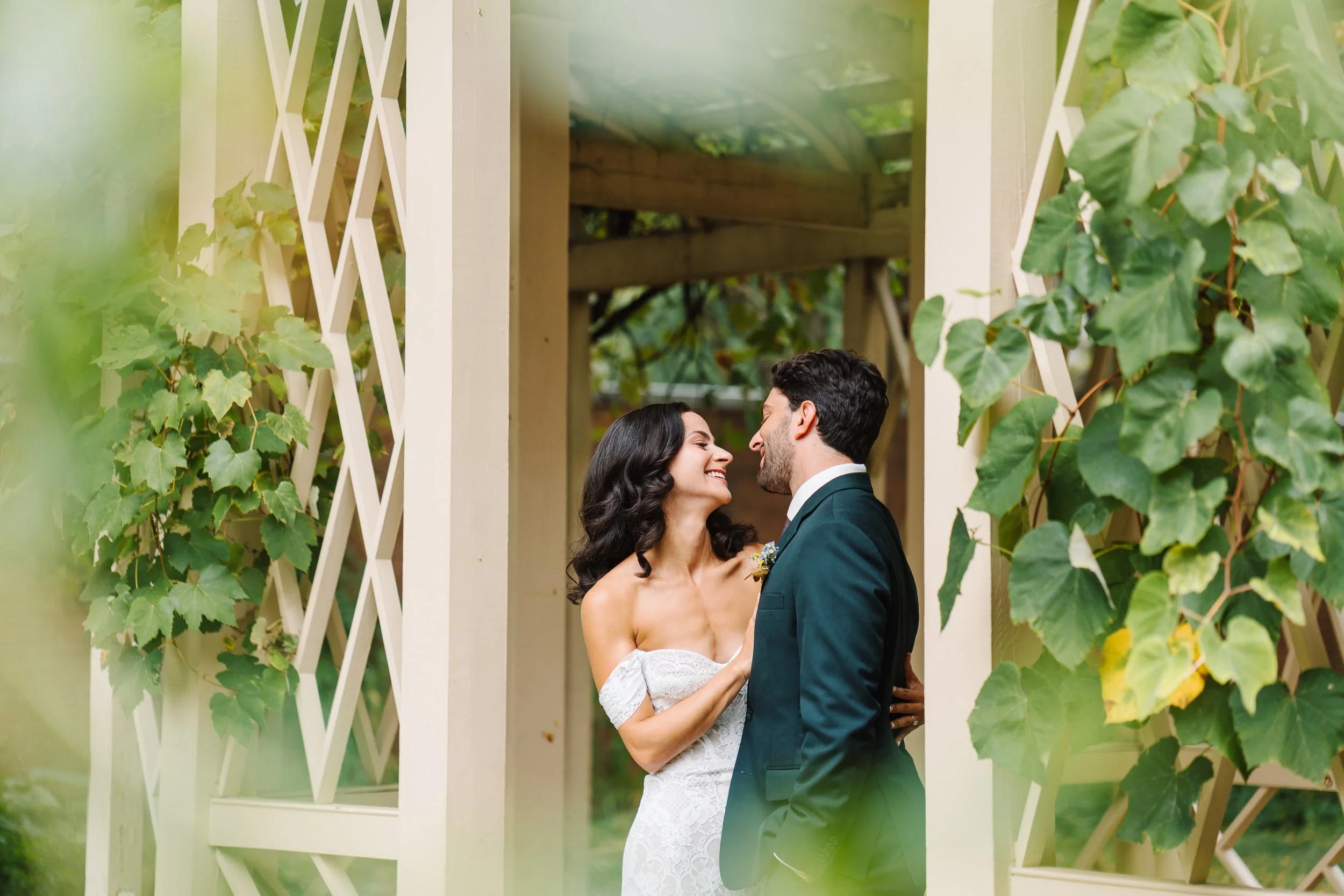 Bride and Groom smiling at 18th Century Garden before their wedding at Lilah