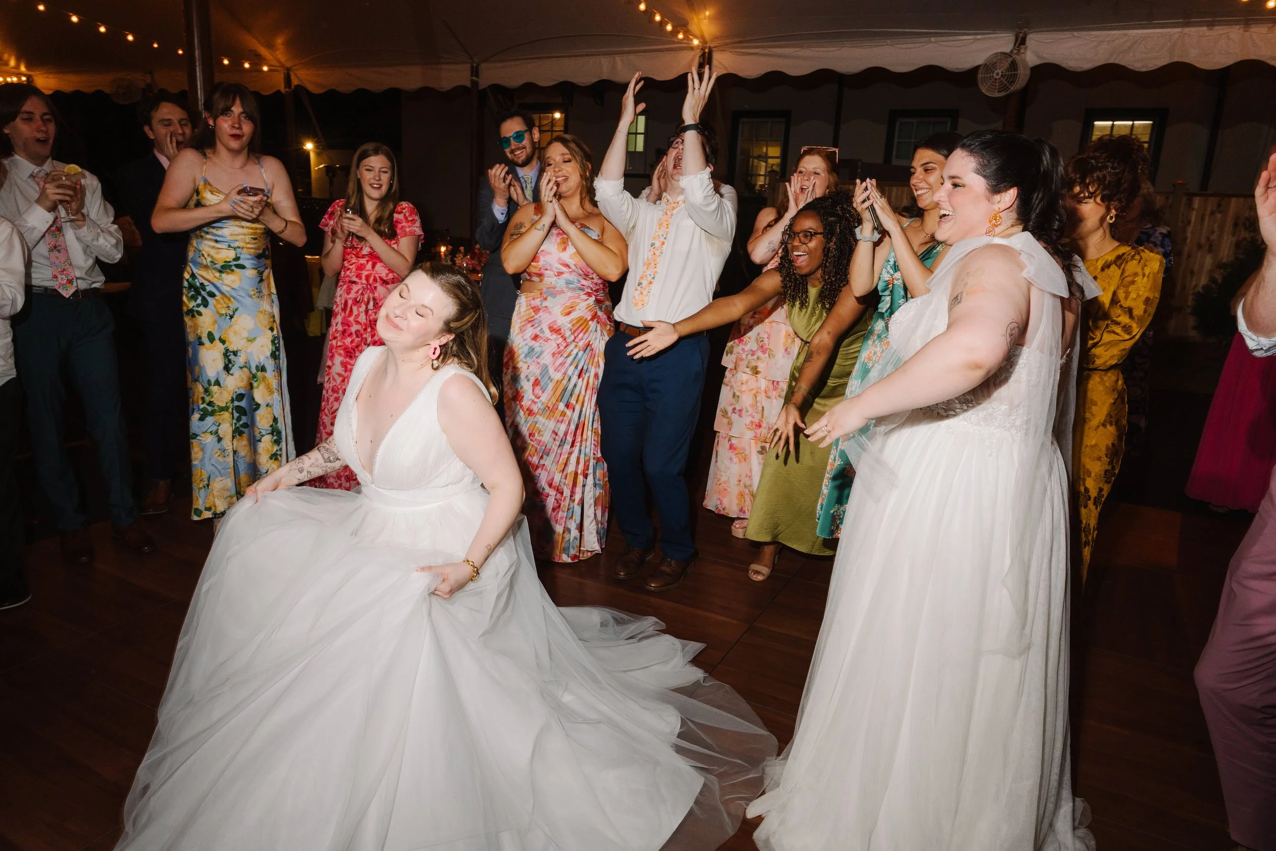 Brides dancing at their wedding reception.