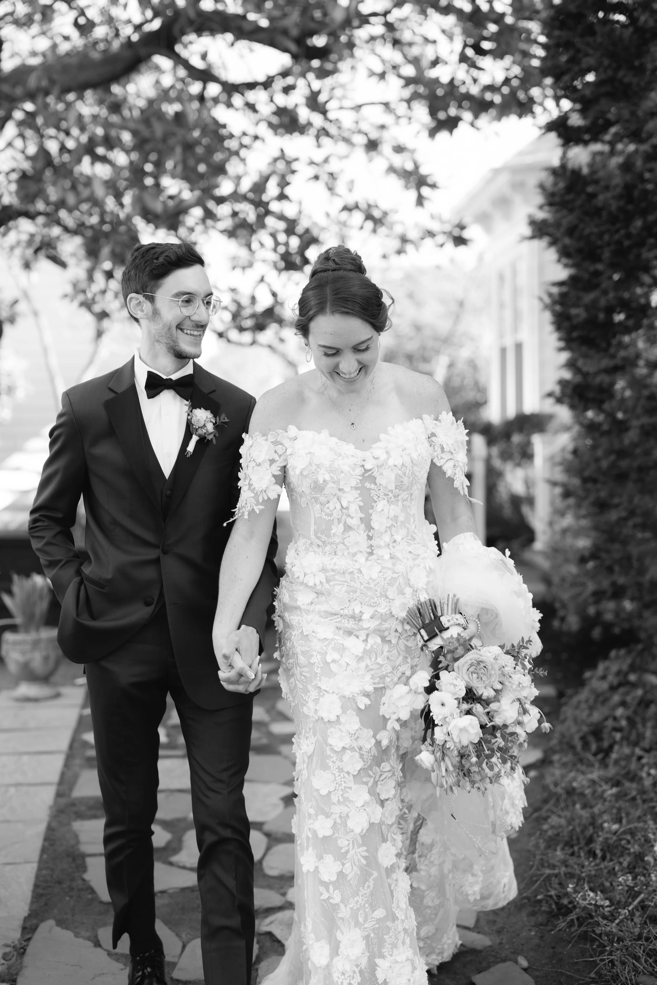 Bride and groom walking together at their favorite coffee shop outside of Moorestown Community House
