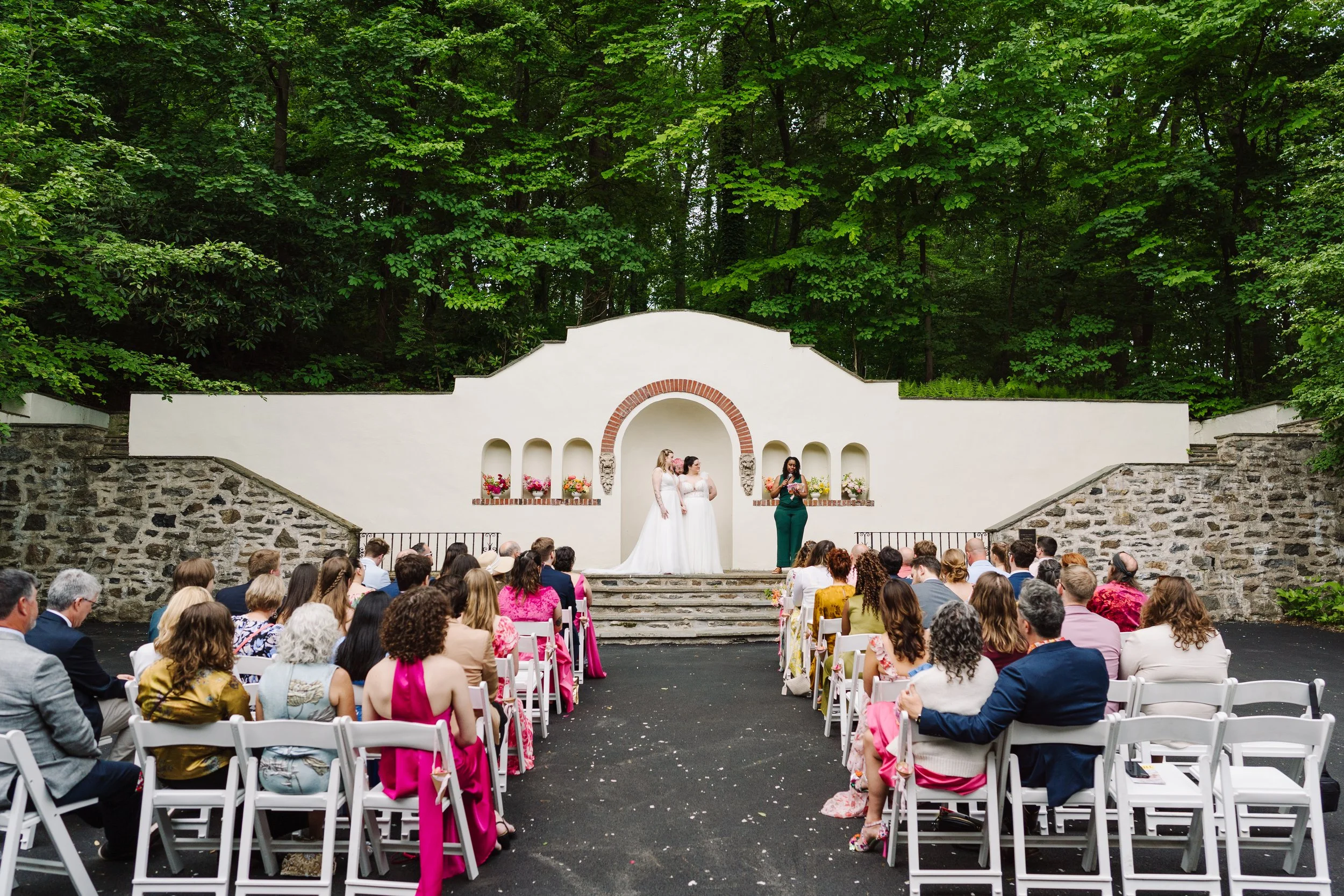 Brides enjoying their ceremony at the altar.