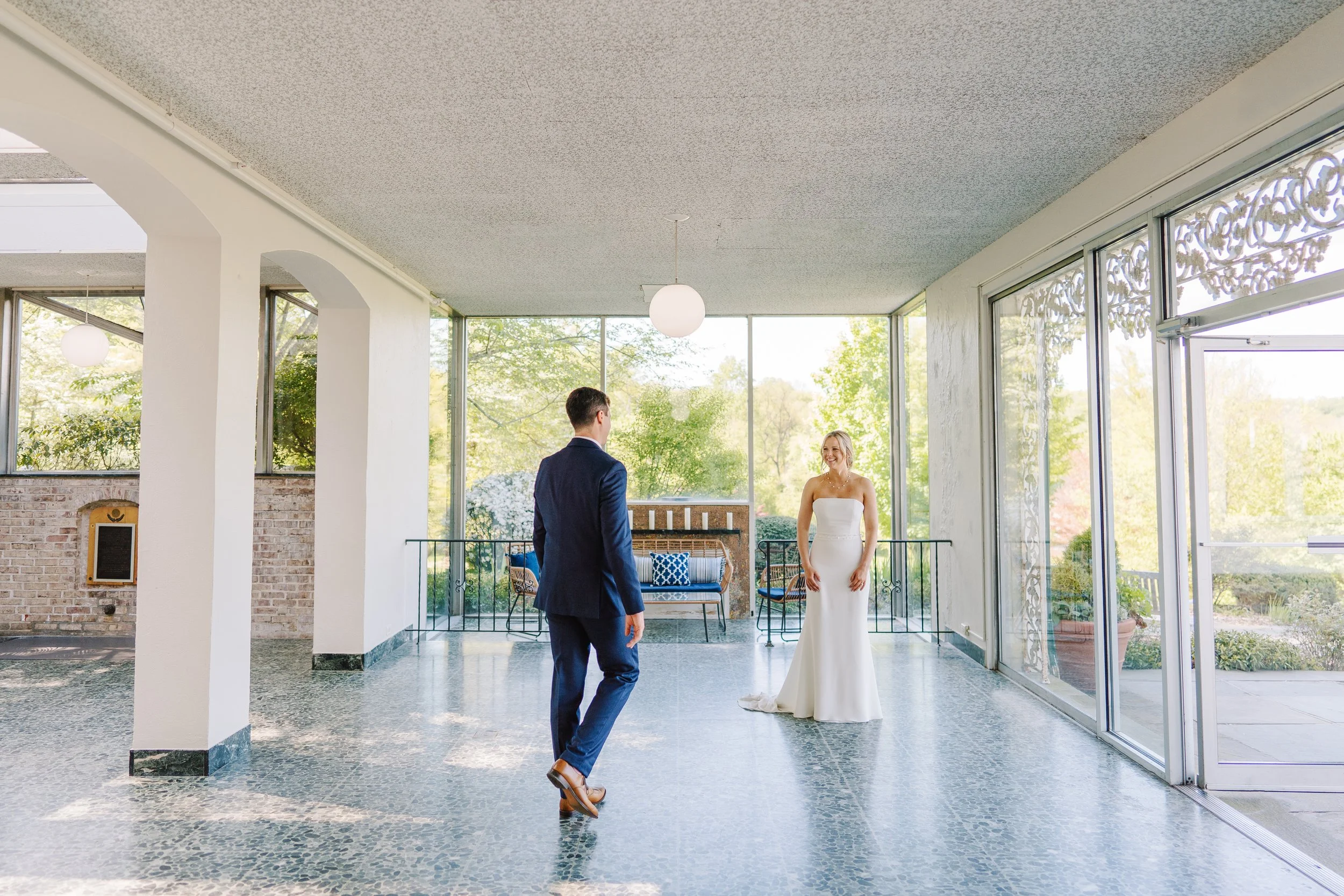 Groom walking to his Bride in the solarium at The Willows at Villanova