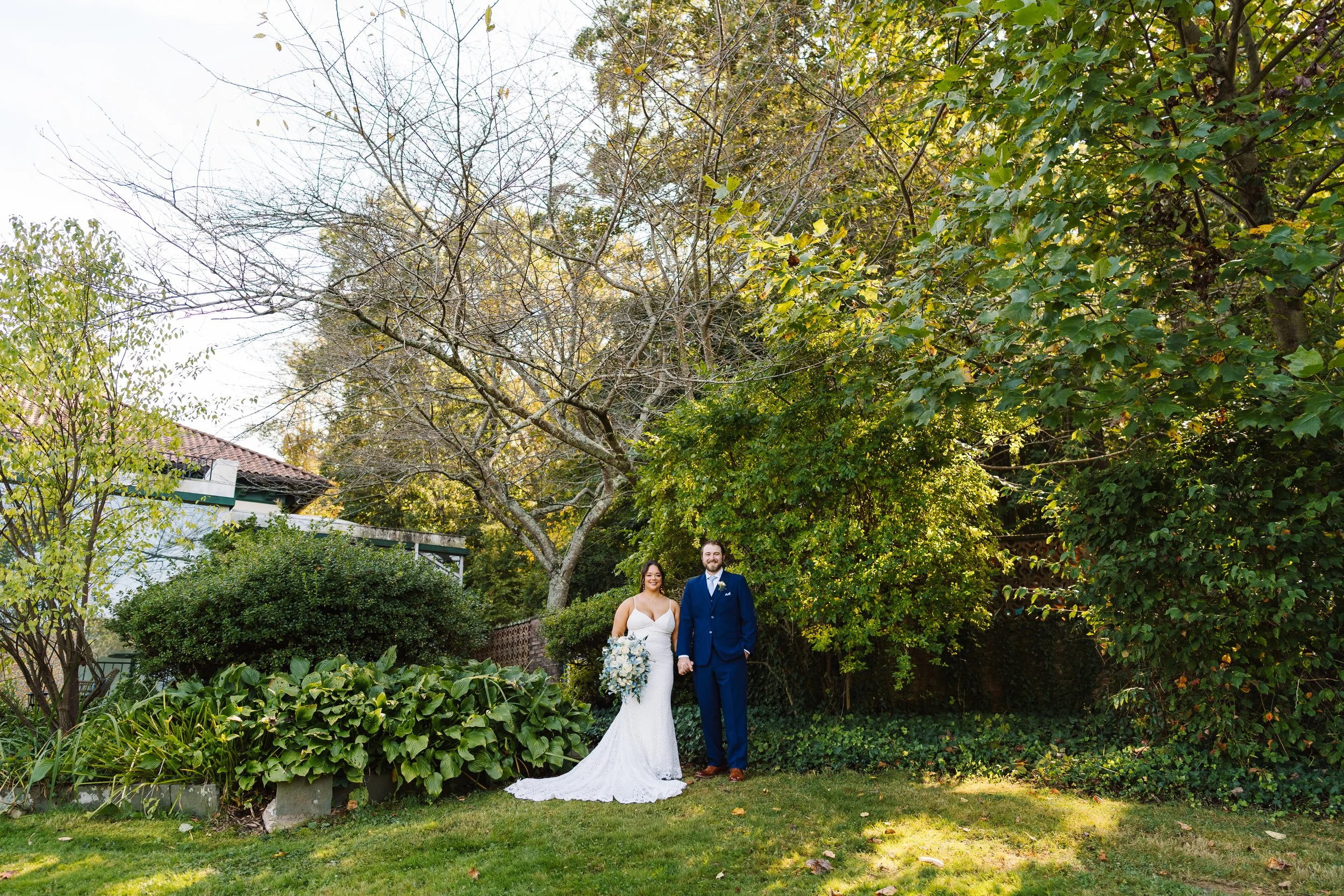 Bride and Groom posing in the garden at The Willows at Villanova.