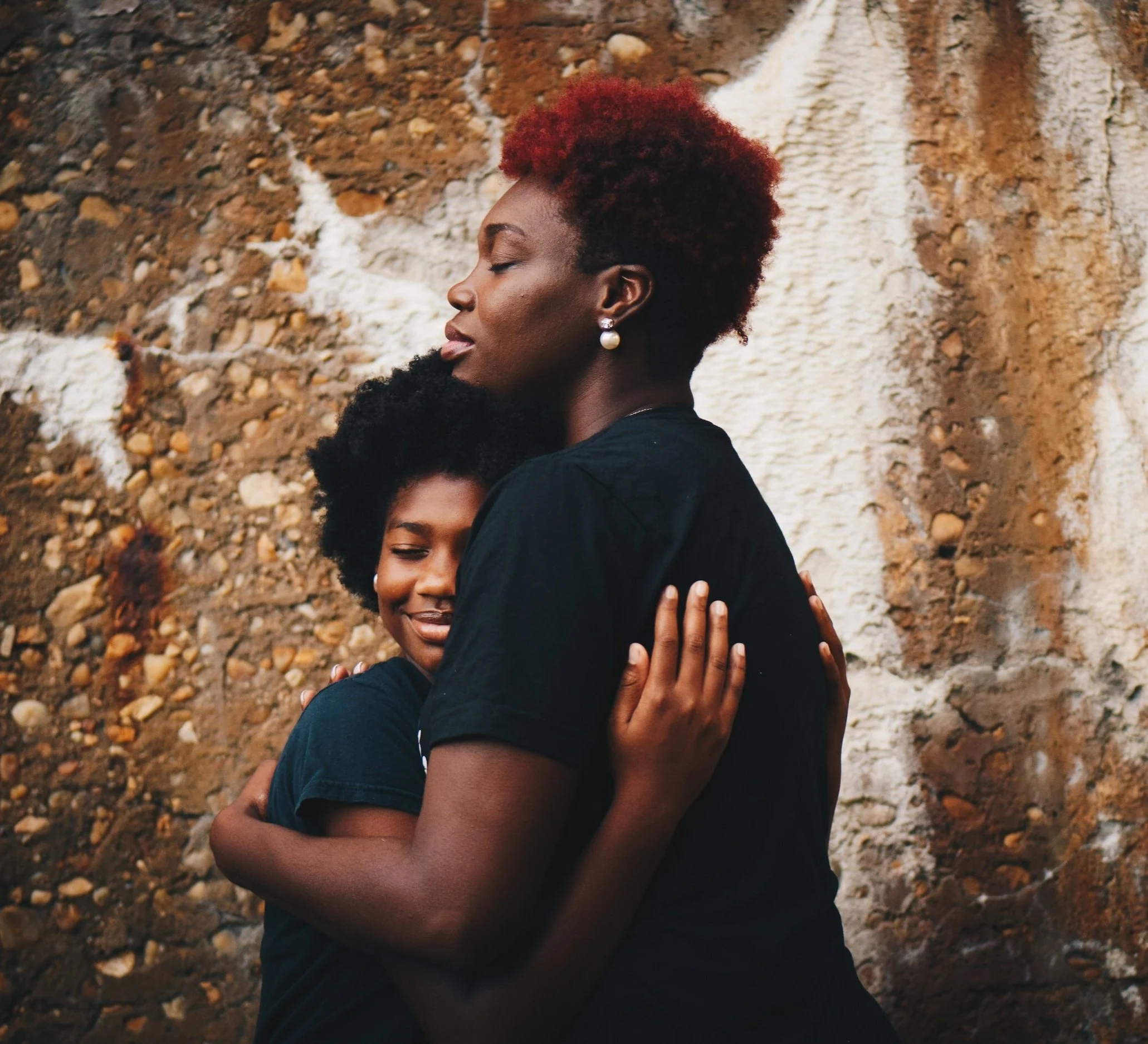 Mother Hugging Son Catholic Counseling in West Metro MN