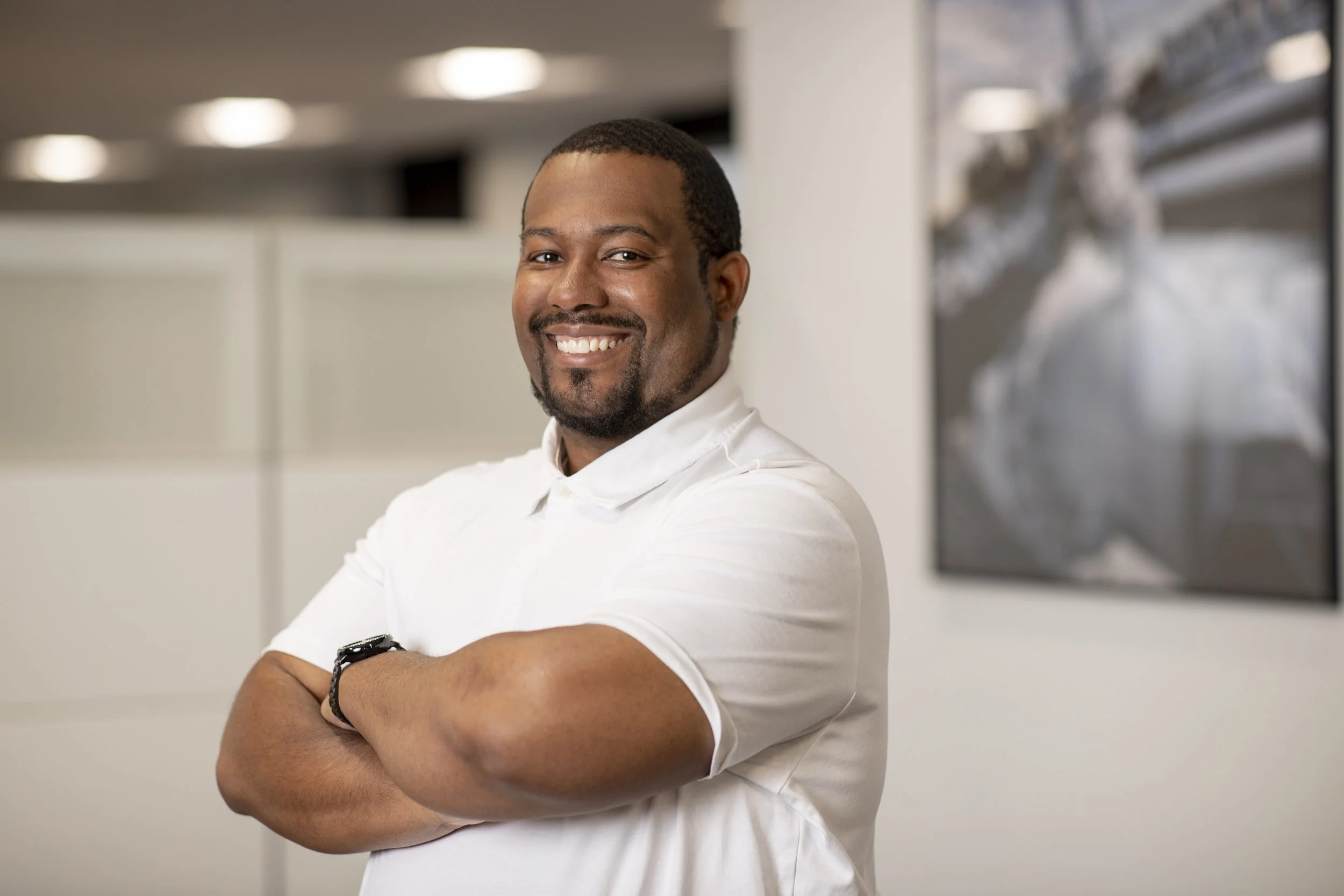 Mikeale Campbell, Diversity & Inclusion Program Manager at Williams sitting on couch at Fulton Street Books and Coffee