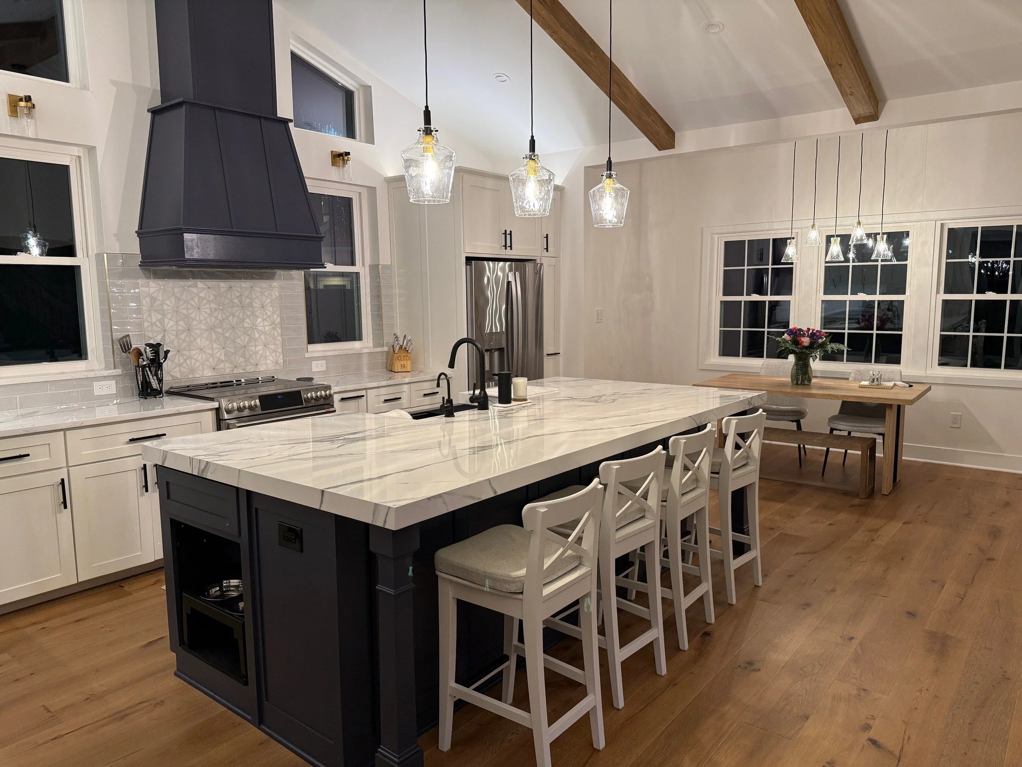 Beautiful Ethereal Silver quartz installed with a mitered island. We love the navy accent with this color quartz. Congrats to our client on a beautiful new kitchen just in time for the holidays. 

Looking to redo your counters in the new year? Contac