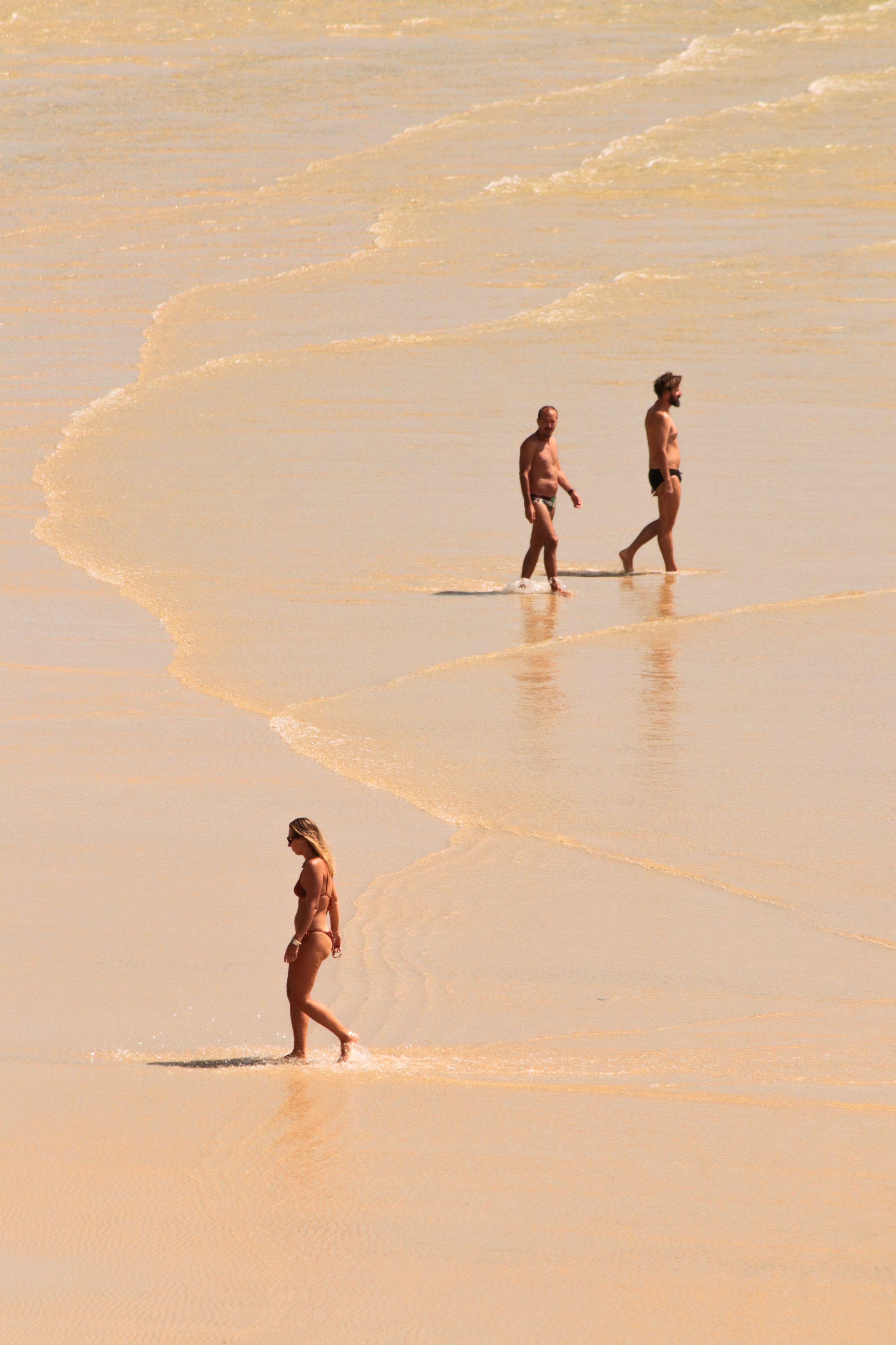peoplewalkingonsand.jpg