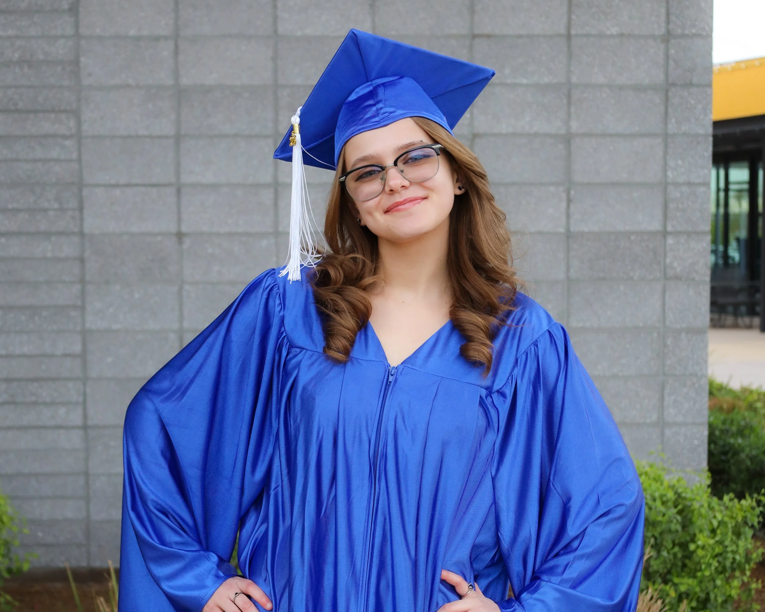 Graduate smiling in her cap and gown