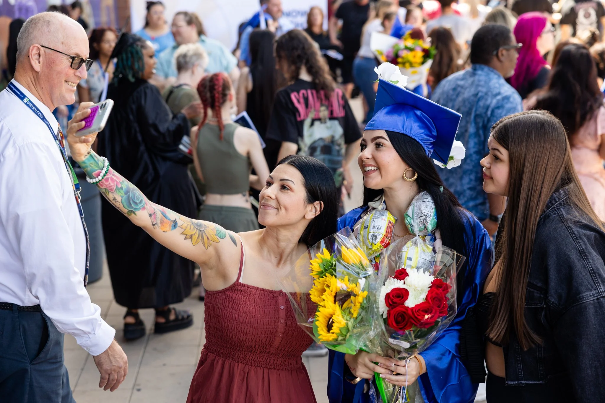 Family posing for a selfie at graduation