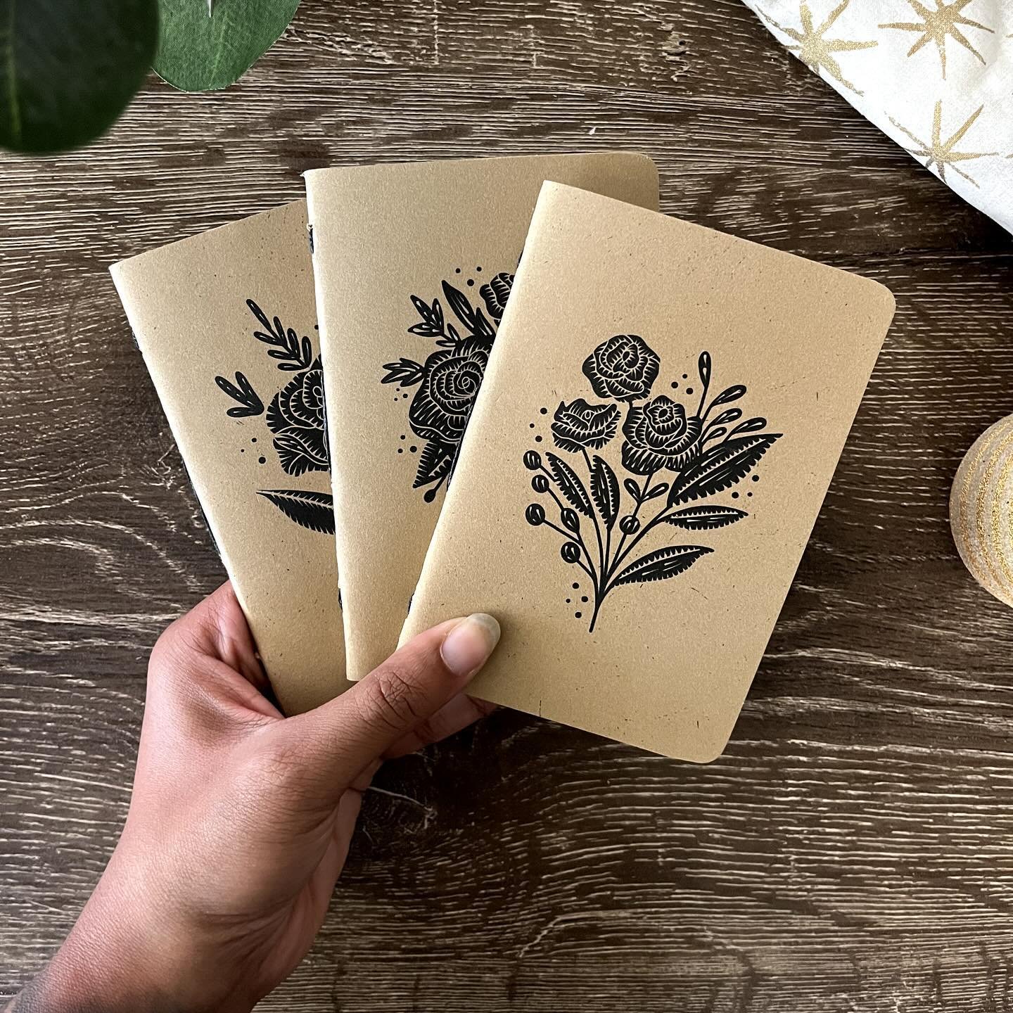 Handcrafted mini sketchbooks, now available! These pocket-sized wonders feature intricately illustrated bouquets of rosebuds, inspired by the rich traditional of linocut printmaking and traditional tattoos. Ignite your imagination wherever inspiratio