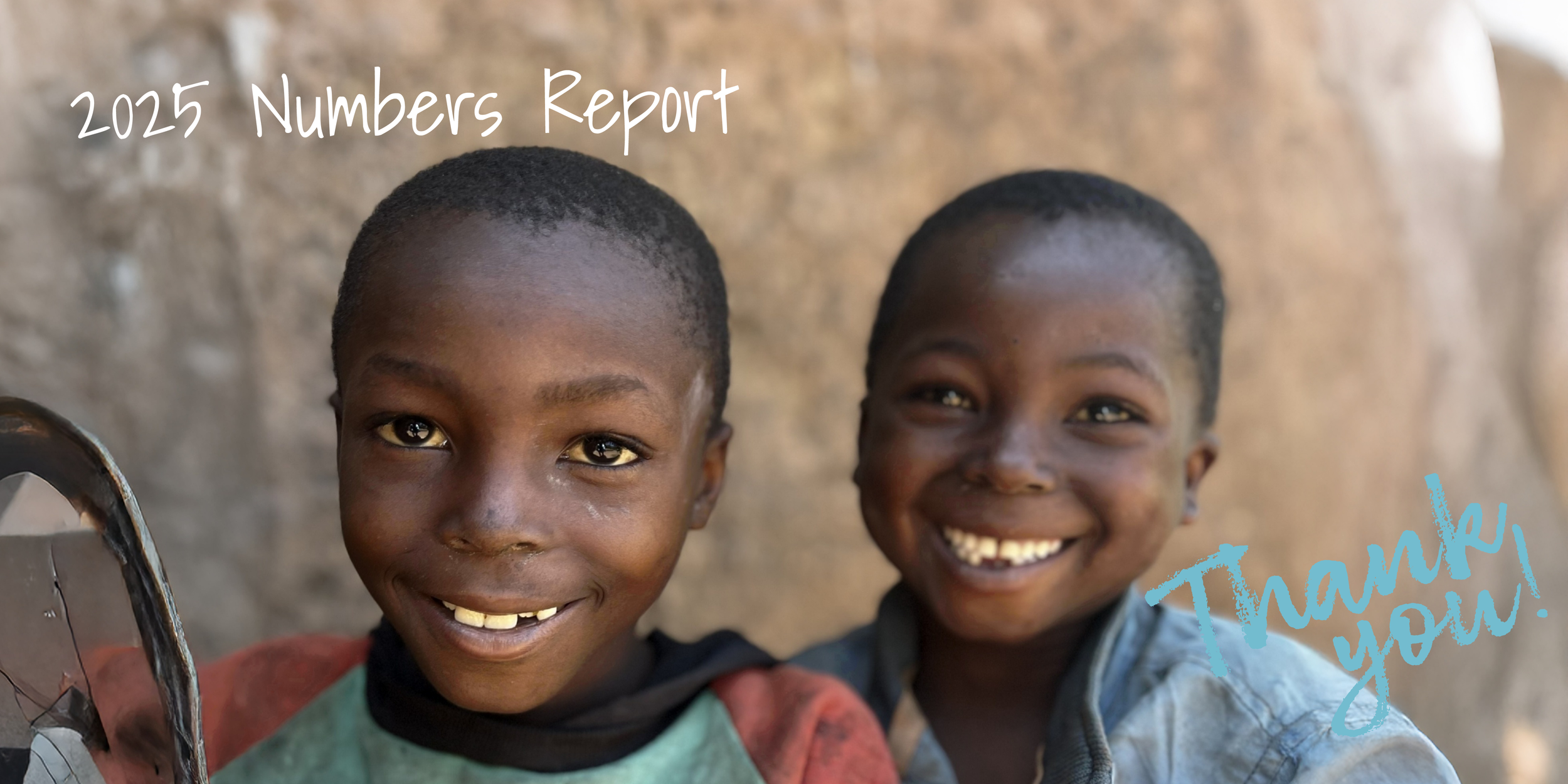 Two smiling children with short hair and dark skin, one holding a broken mirror, standing outdoors against a rocky background. Overlaid text reads '2025 Numbers Report' and 'Thank you!'