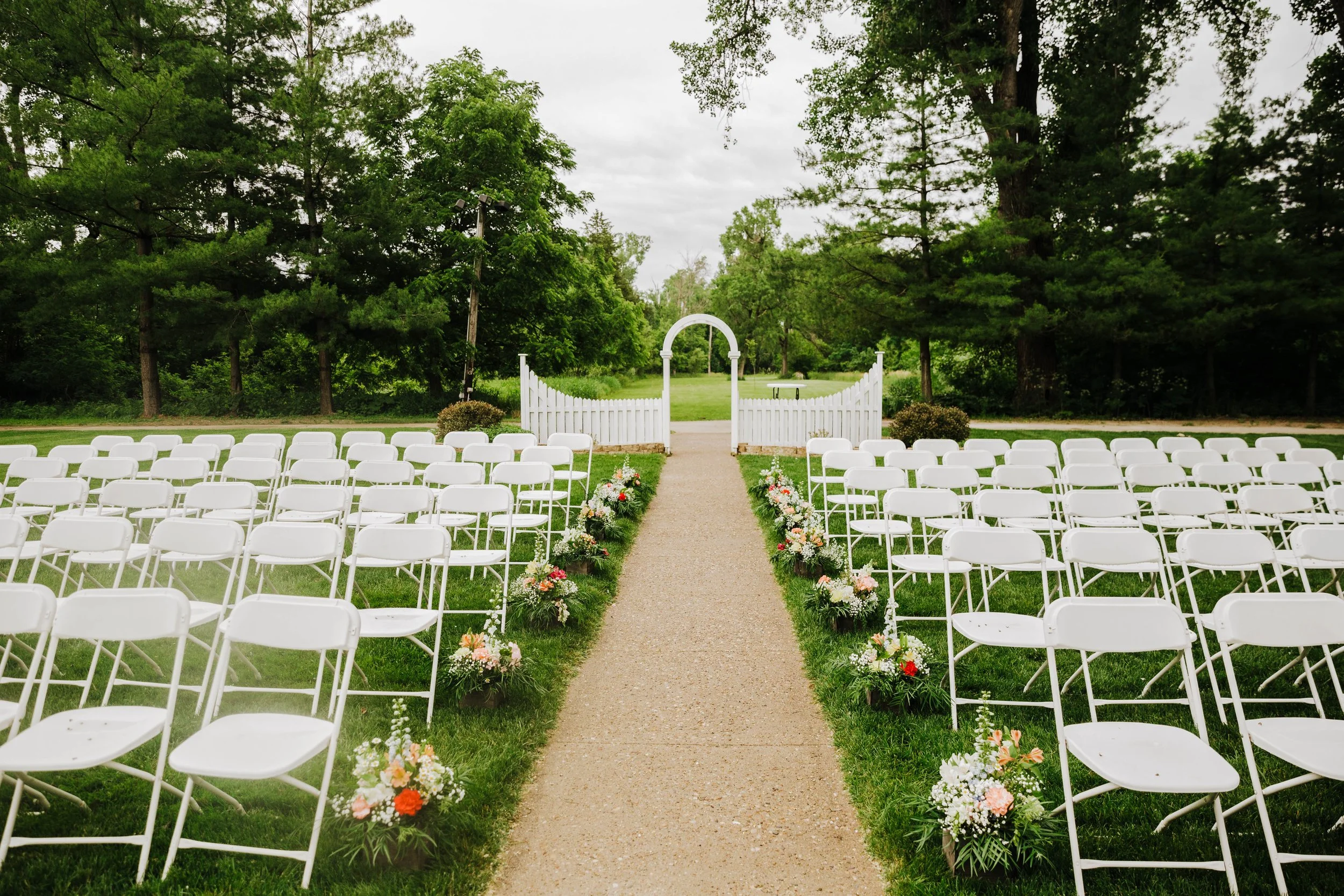 Bride and groom exchanging vows during an outdoor wedding ceremony in Iowa