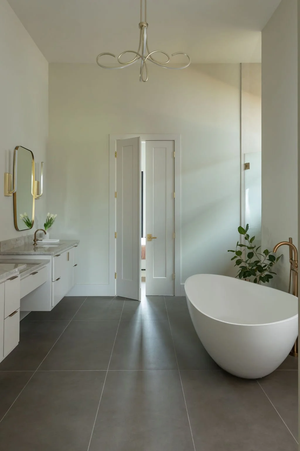 dantin-builders-signature-home-denham-springs-la-primary-bathroom-brass-fixtures-02.jpg
