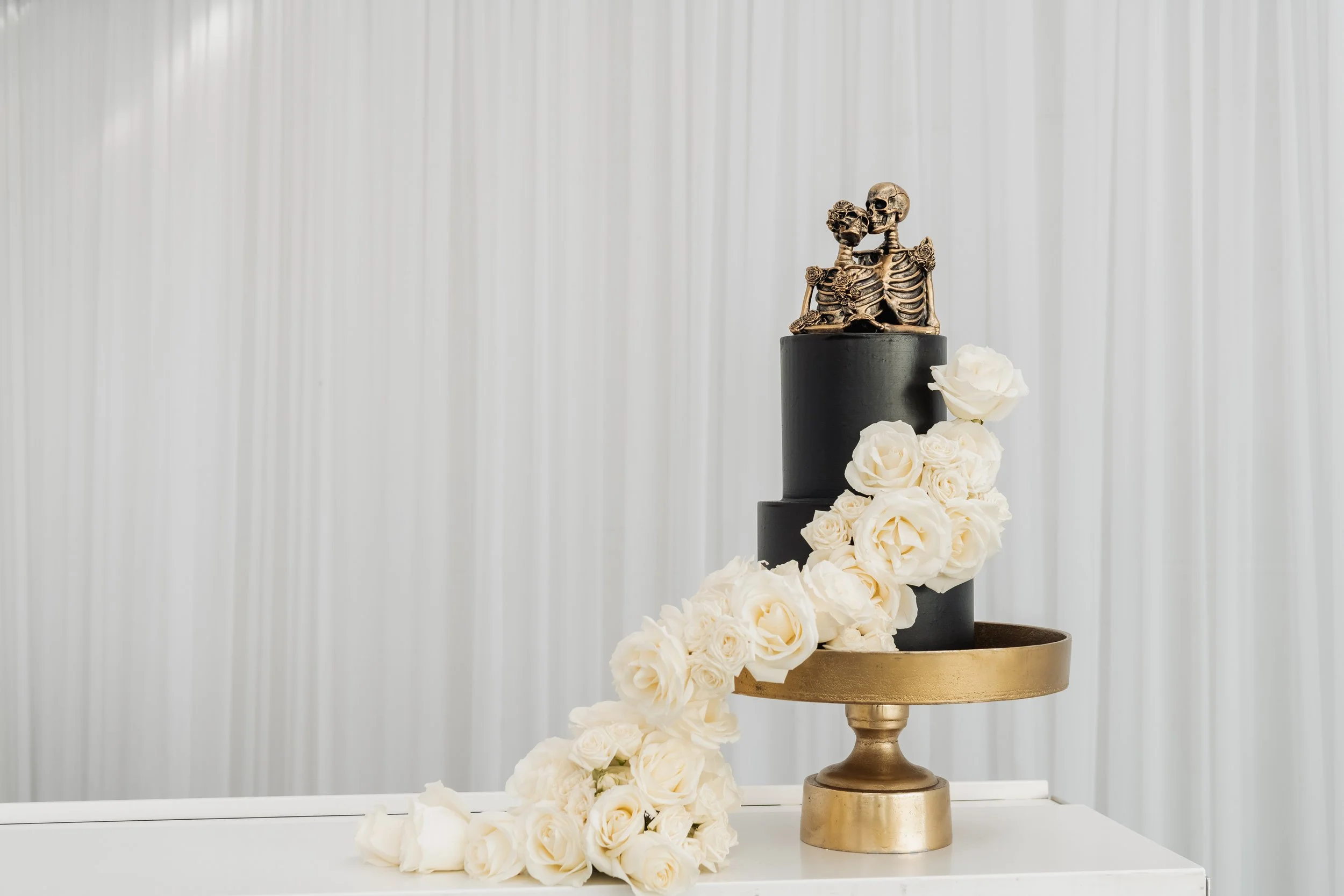 rock and roll wedding cake decoration with white roses