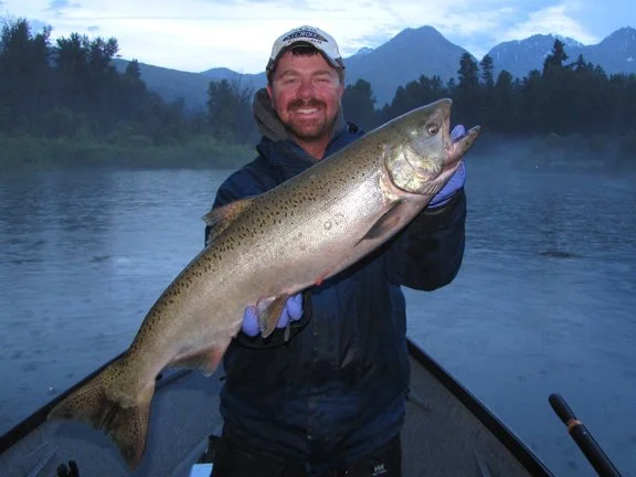 photo of the owner of upper columbia guide service showing Shane Magnuson holding a big fish.