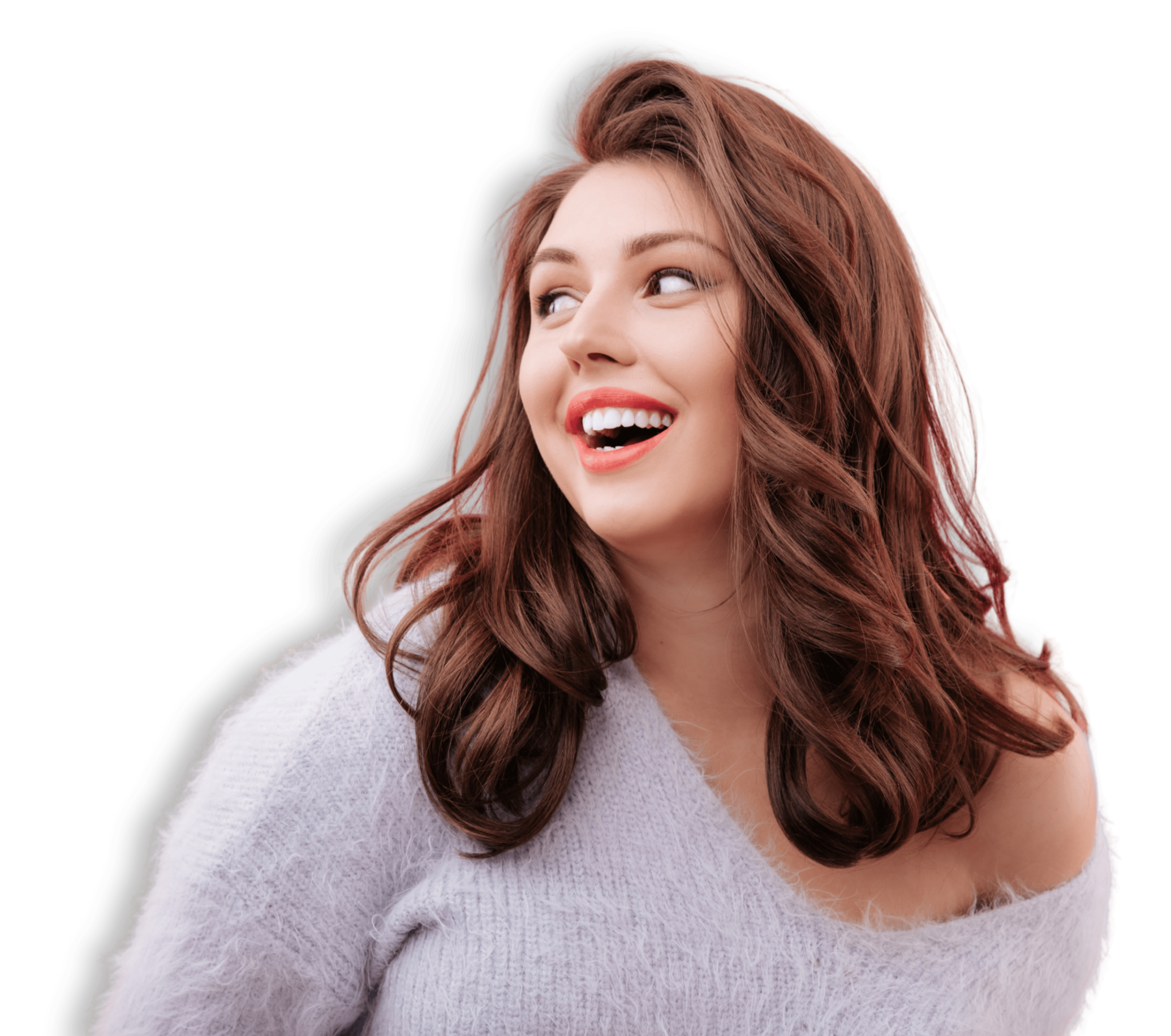 Close-up of a young woman with wavy auburn hair, smiling, wearing a white fuzzy sweater against a black background.