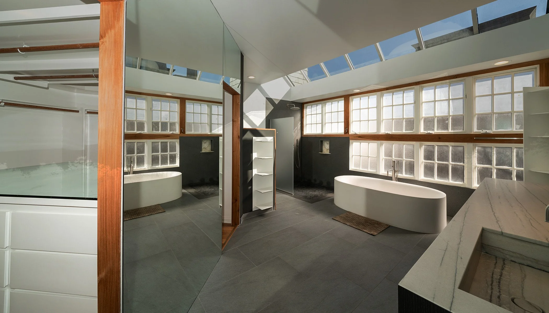 modern bathroom with multiple skylights professional real estate photograph
