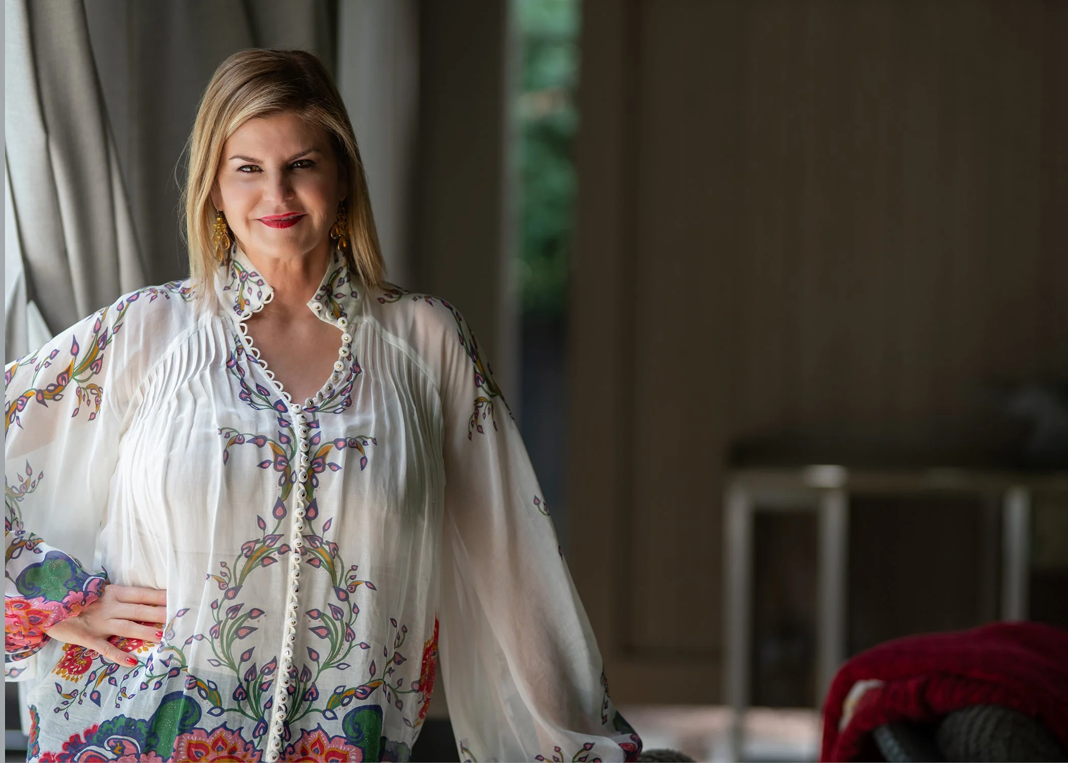 Window light portrait of modern businesswoman and author.