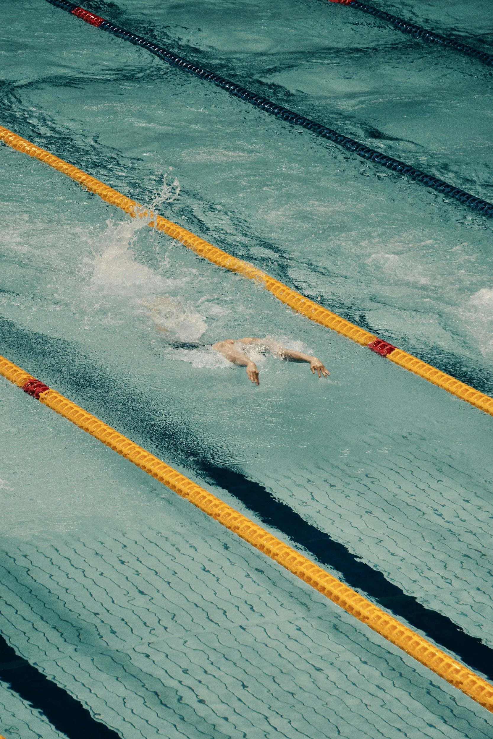 pool with swimmer in lane