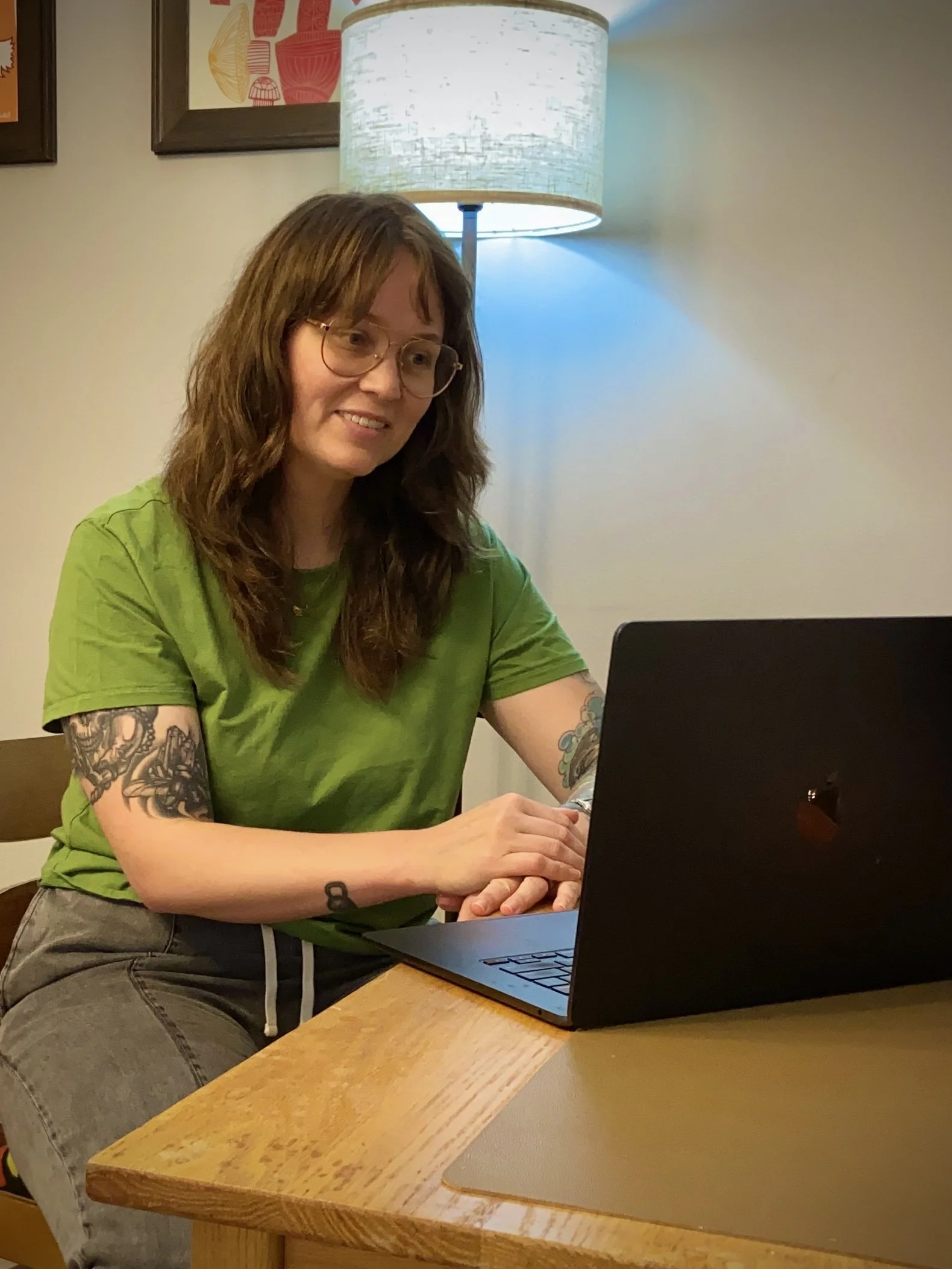 woman sitting at a desk at a computer