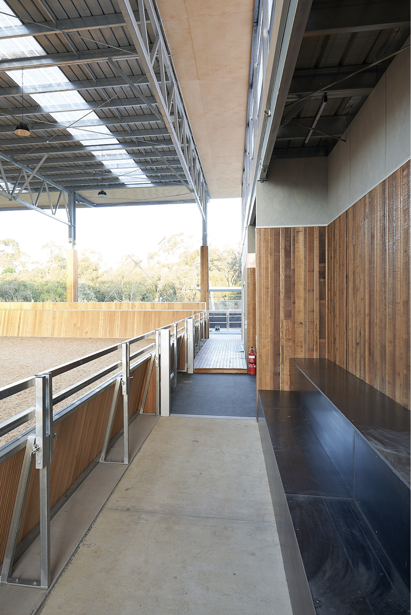 viewing deck within the covered stable arena, offering a vantage point for spectators to observe and appreciate the equestrian activities taking place