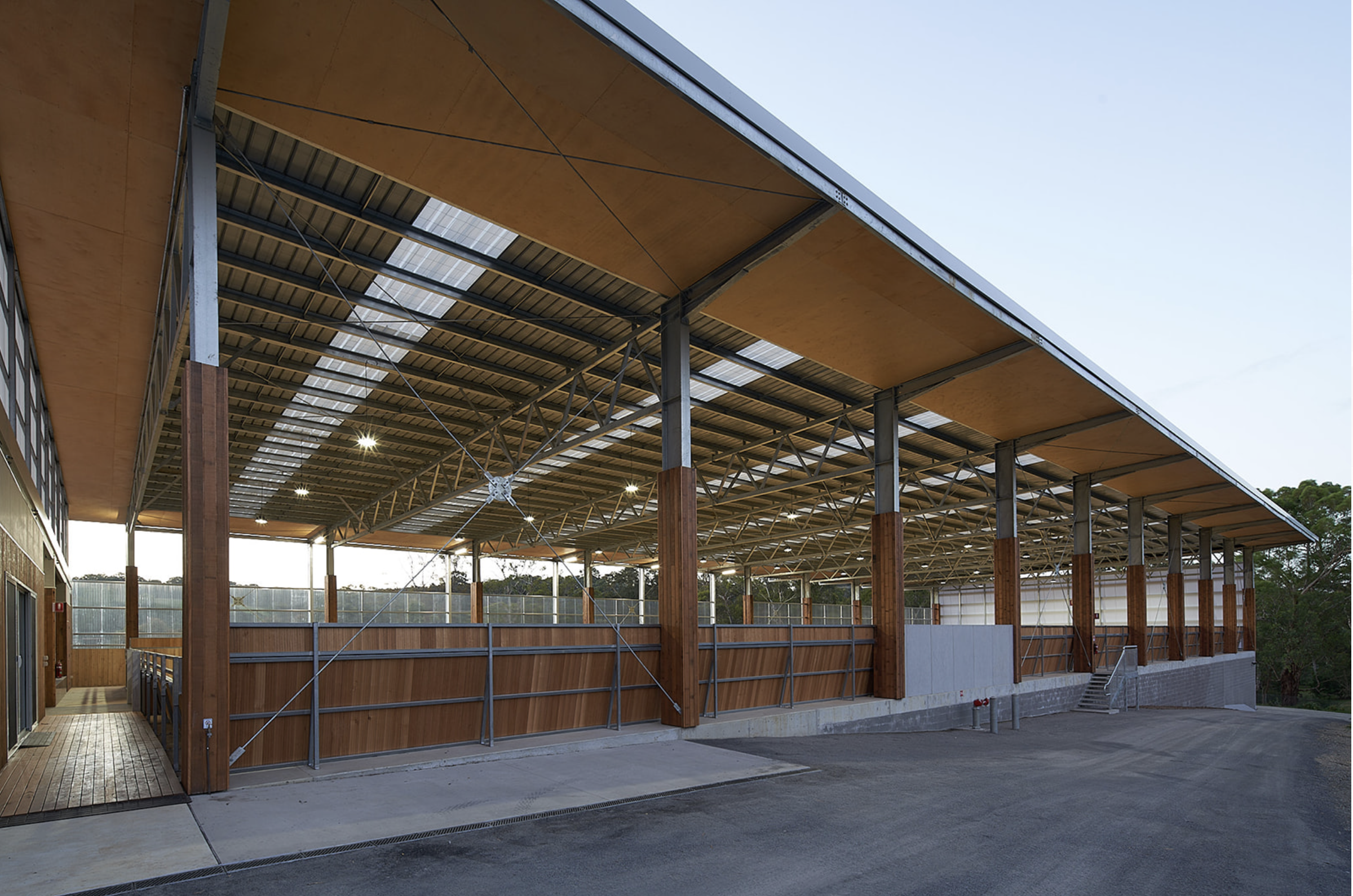 a view of the covered stable arena's lobby, presenting an inviting entrance area that serves as a hub for equestrian activities.